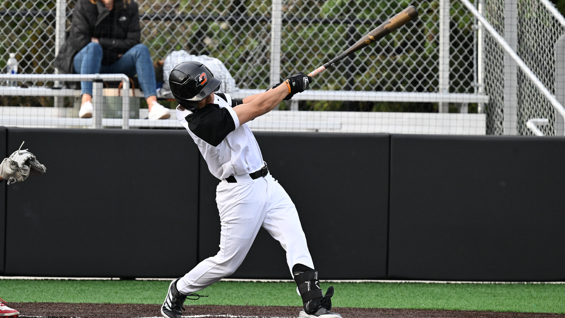 Yuma Noda takes a big swing and drives the ball to the outfield