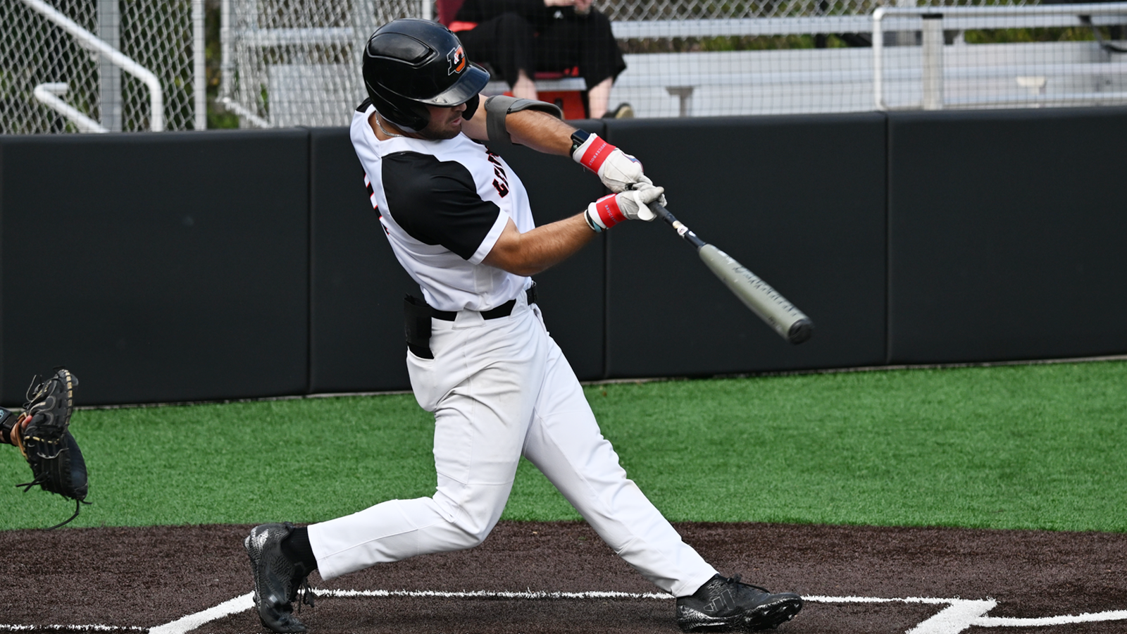 Gavin Mangano swings and belts a line drive 