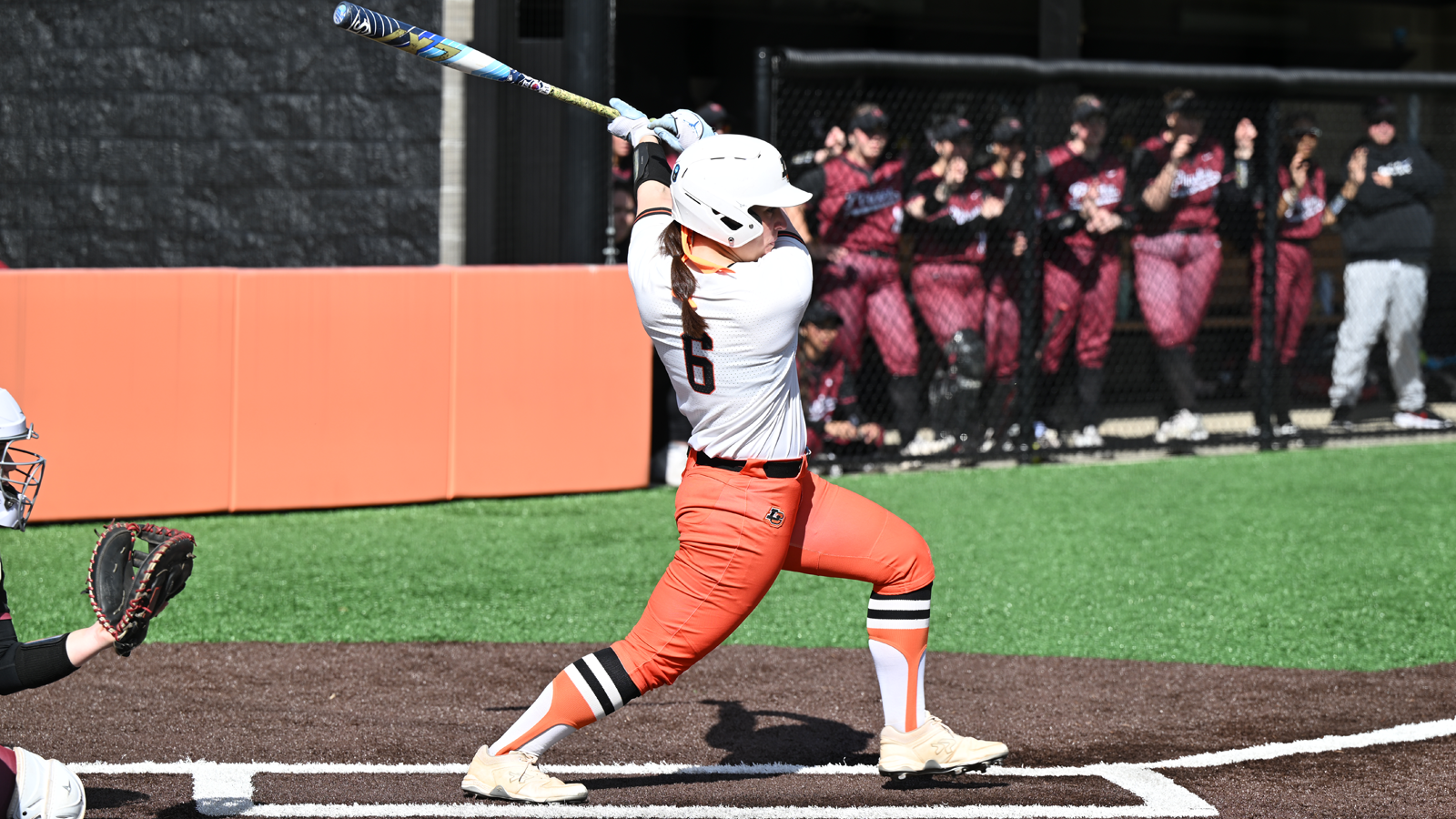 Harper Campanella swings and watches the ball fly off her bat