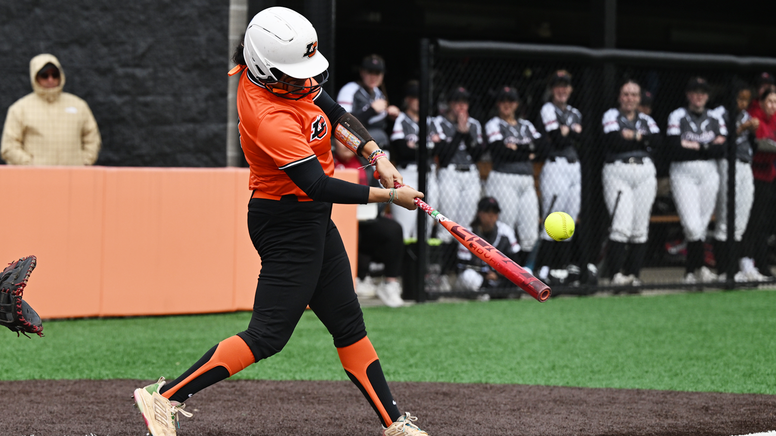 Makena Dahir swings the bat and hits a home run 