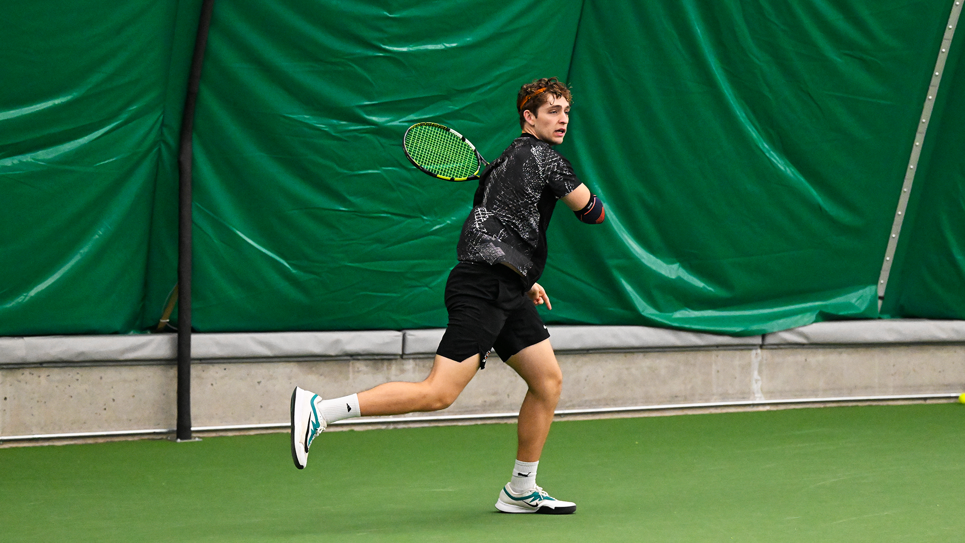 Spencer Loucks swings through on a baseline forehand. 