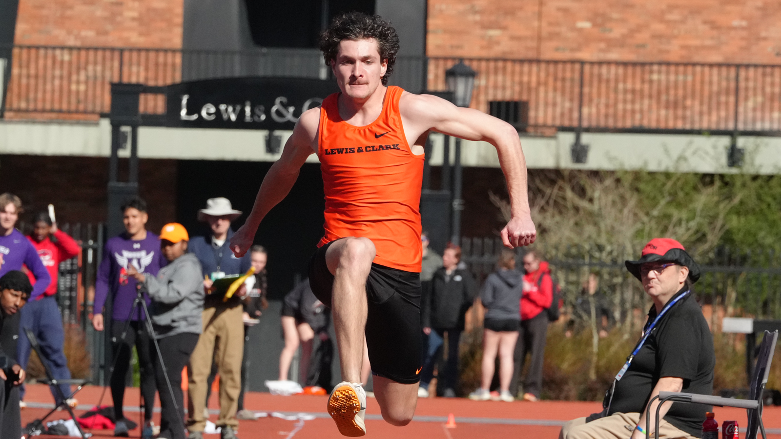 Keegan Zaso jumps during his run-up during the triple jump