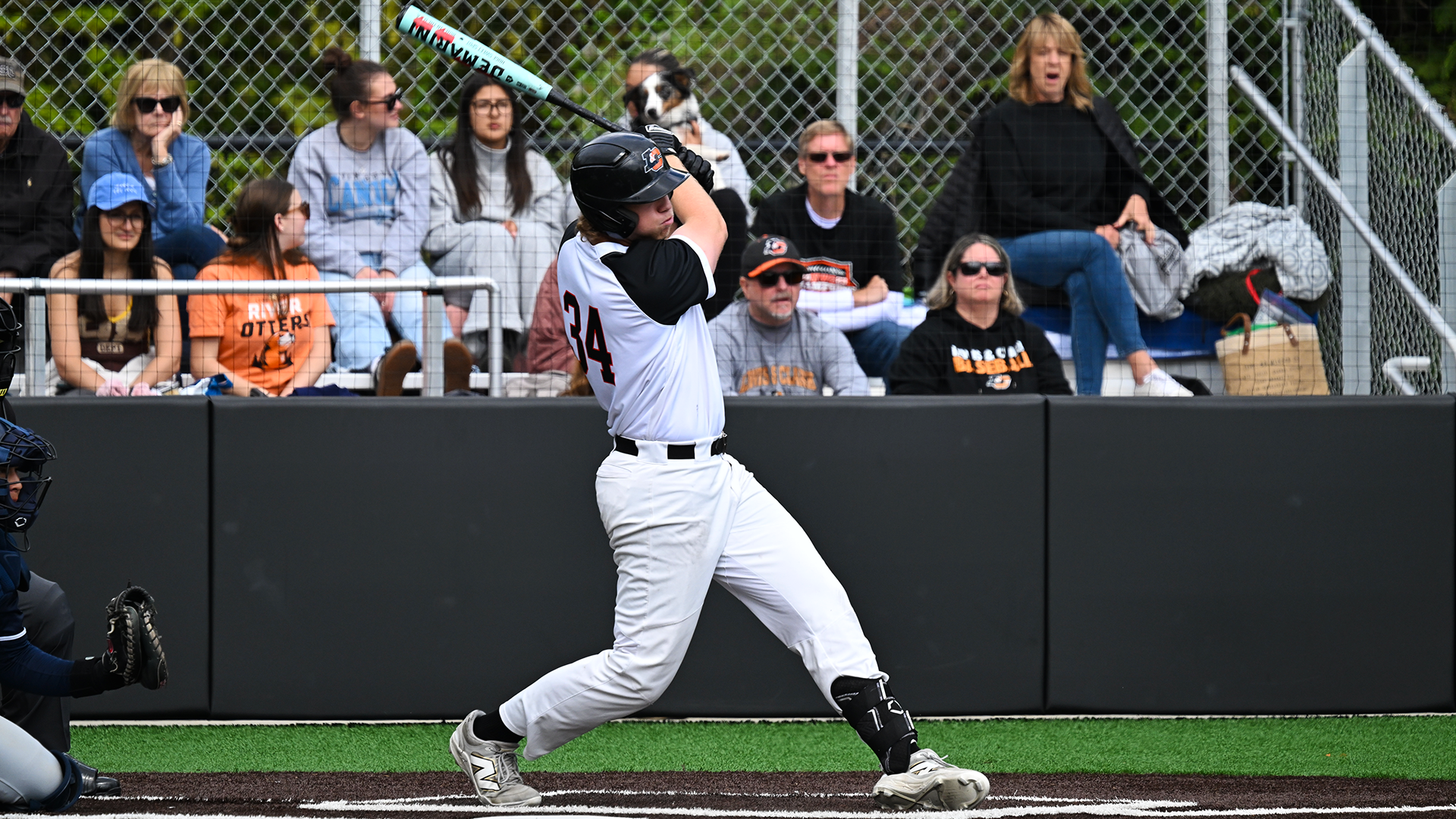 Garrett Lewis hits the baseball in a recent game.