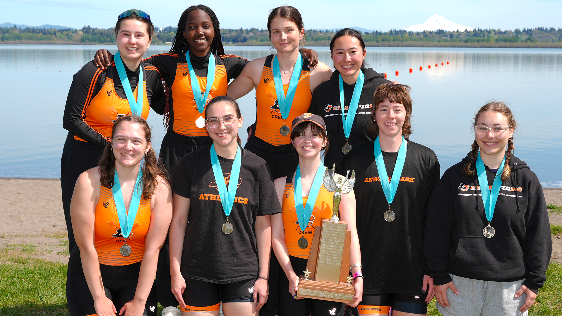 The W-Squad second varsity eight team poses with the NCRC trophy. 