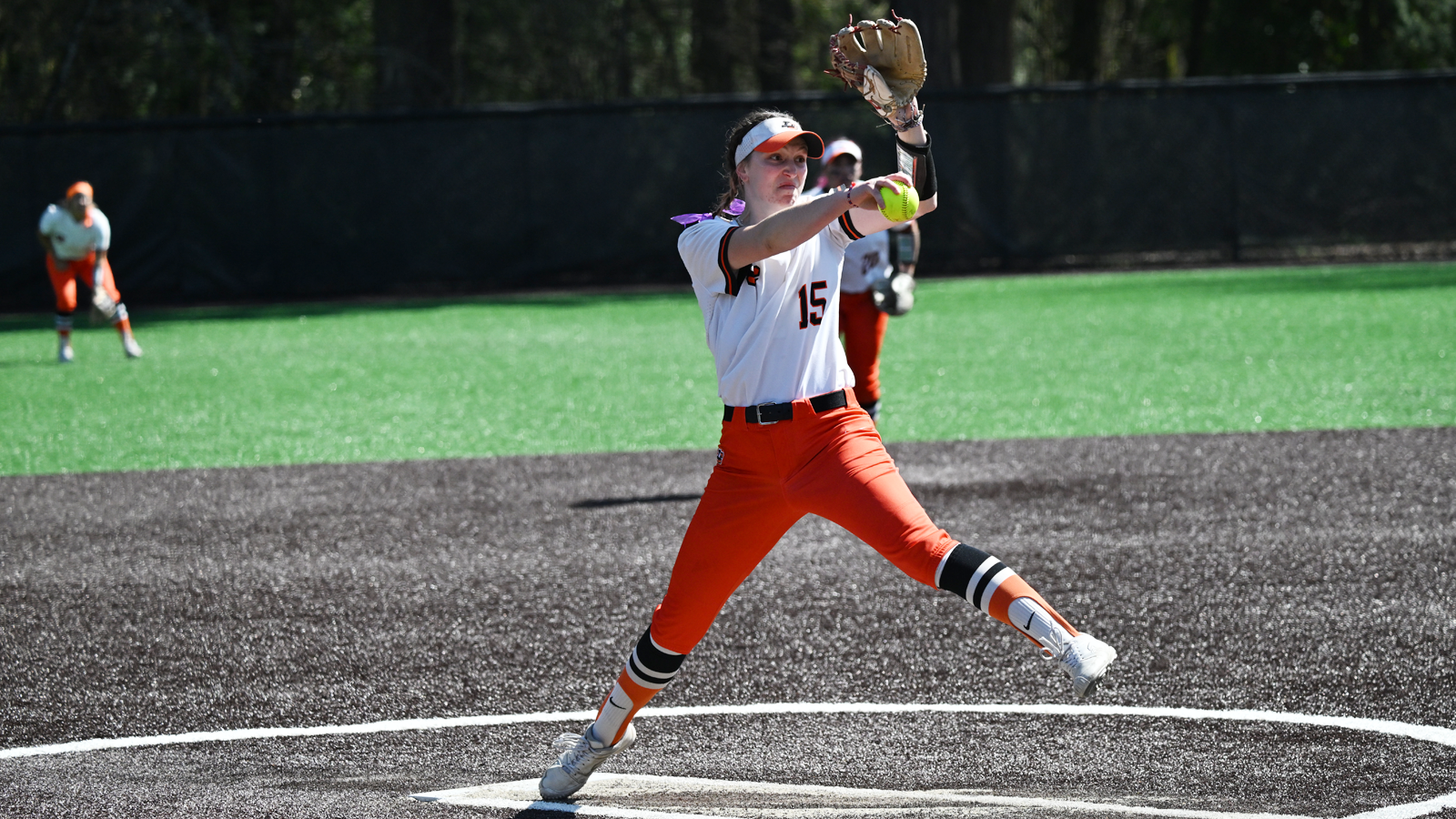 Maggie O'Leary throws a pitch against the College of St. Benedict