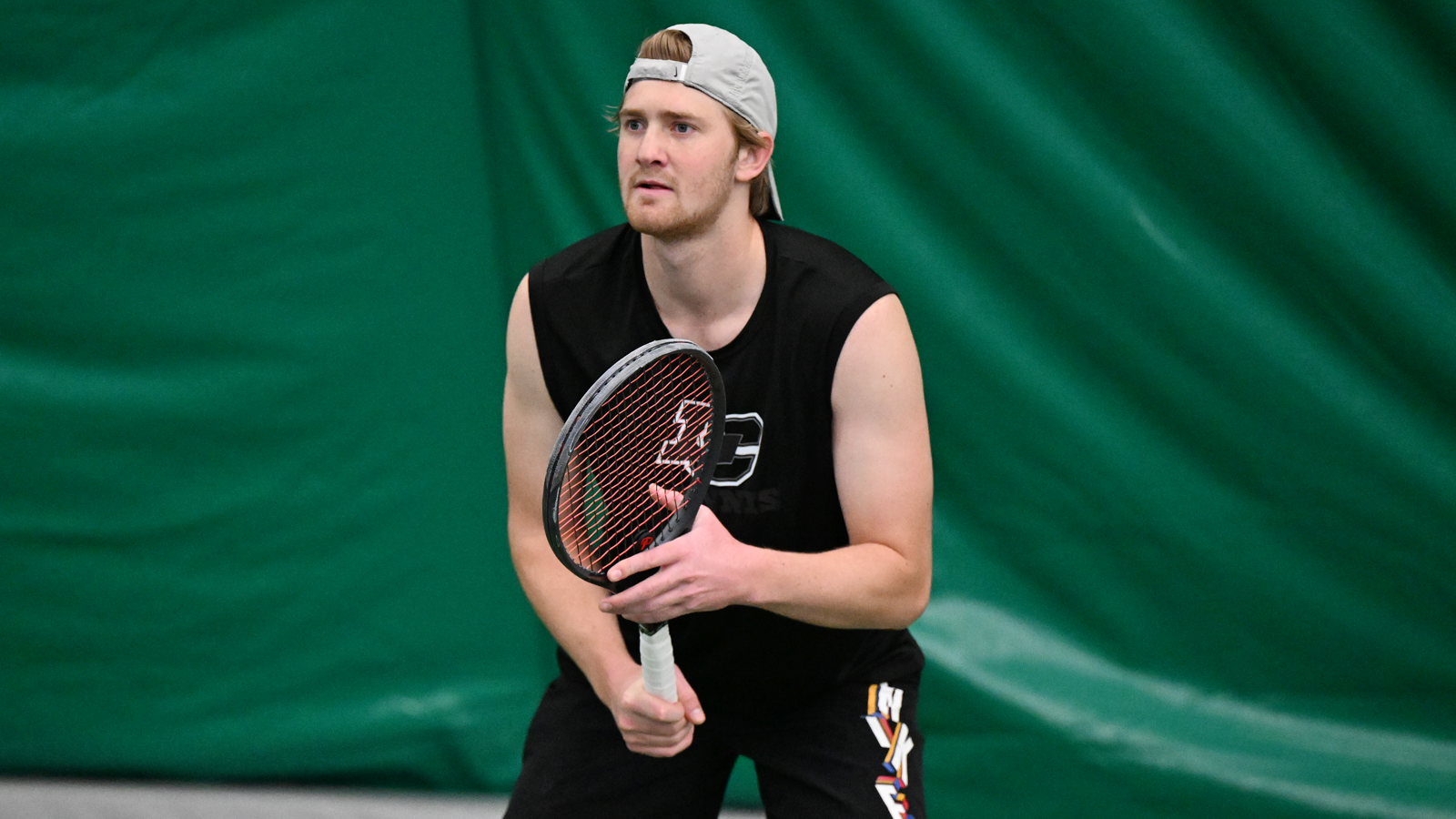 Bridger Galyardt stands behind the service line awaiting a serve