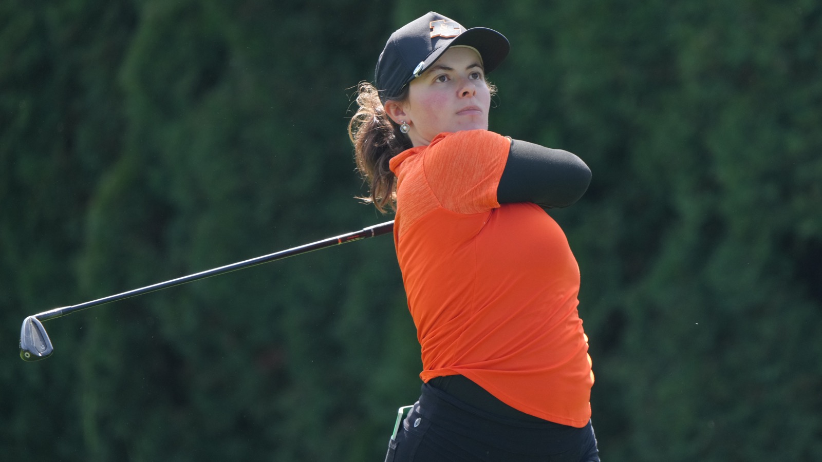 Evie Denton watches her iron shot fly towards the green