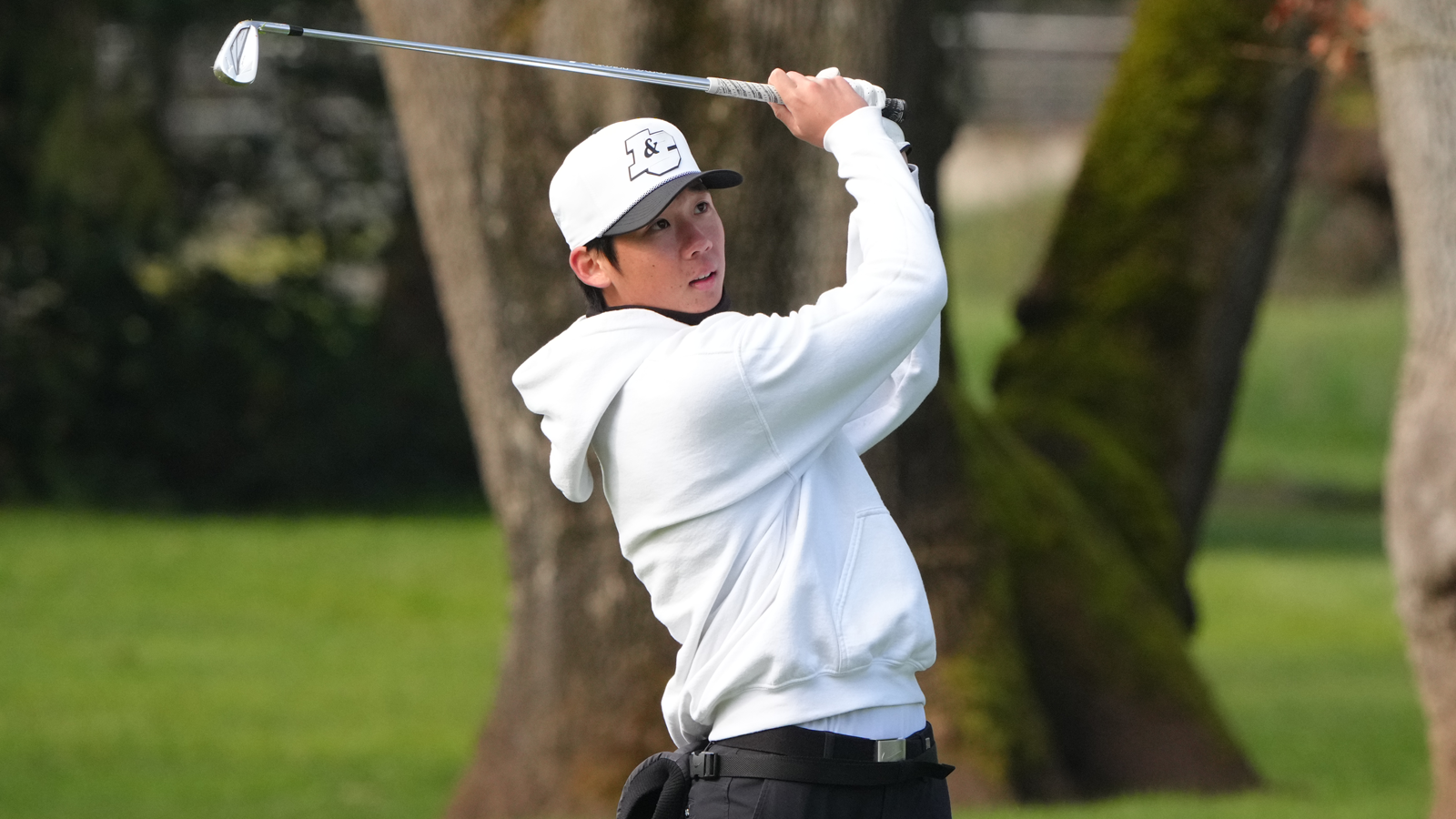 Joonho Moon watches his iron shot fly towards the green