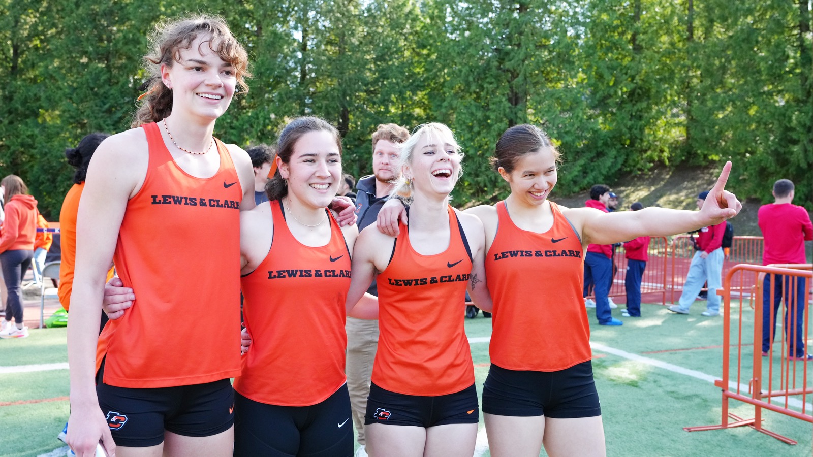 Malia Heien, Callow Soto, Miriam Reside and Elsie Chin pose for a photo after running the 4x400M Relay