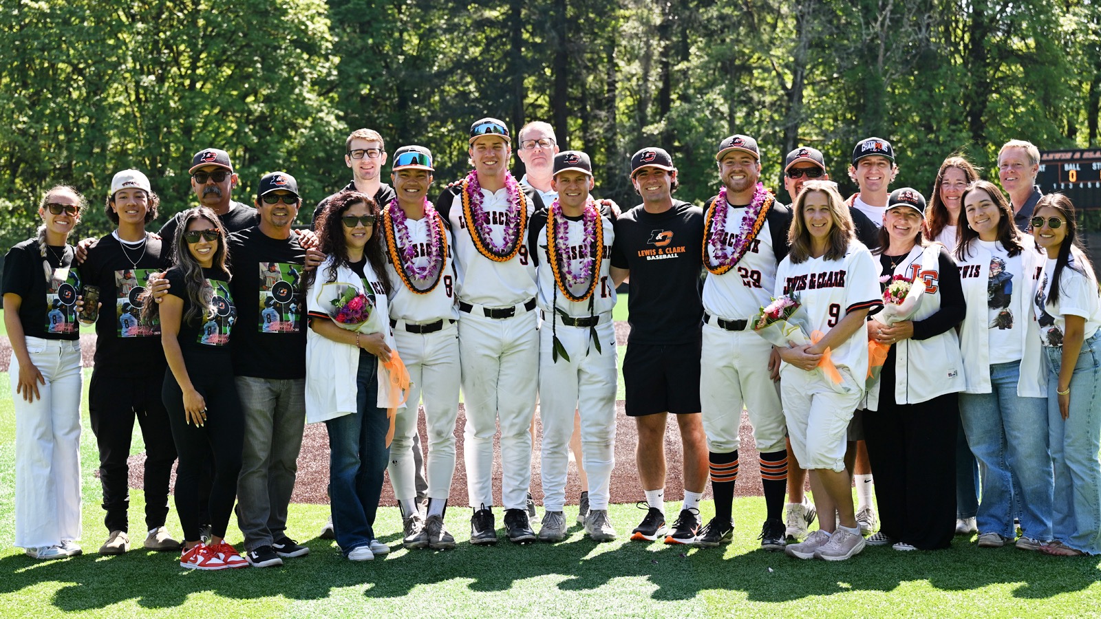 Baseball's five seniors and their families pose for a photo on Senior Day