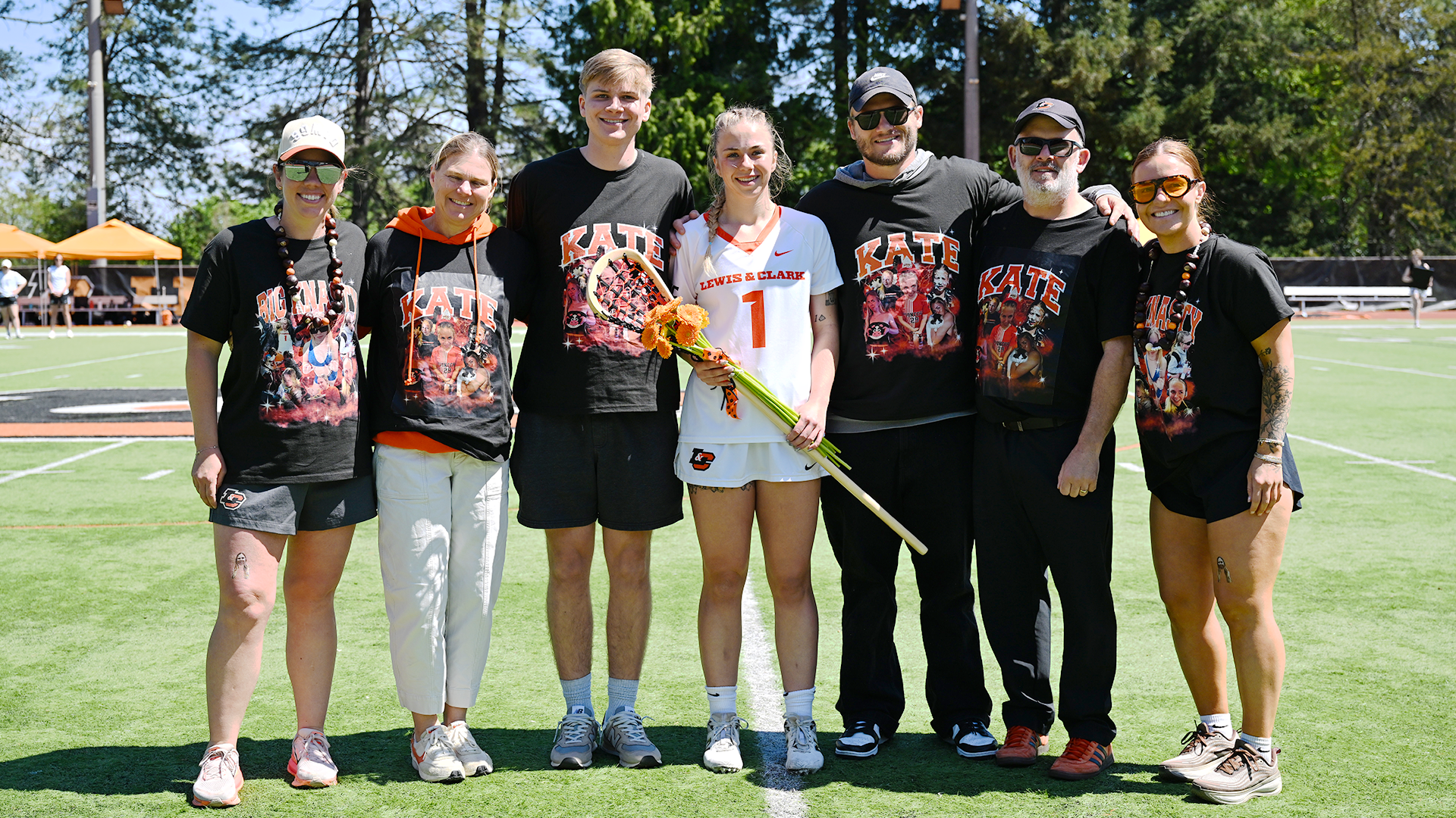 Kate Meinhard poses with her family and coaches. 
