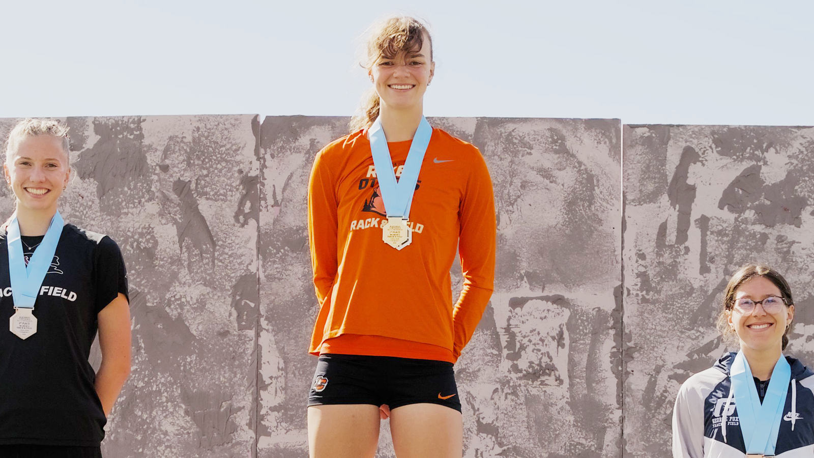 Malia Heien stands at the top of the podium after winning the 800M at the 2026 NWC Championship Meet