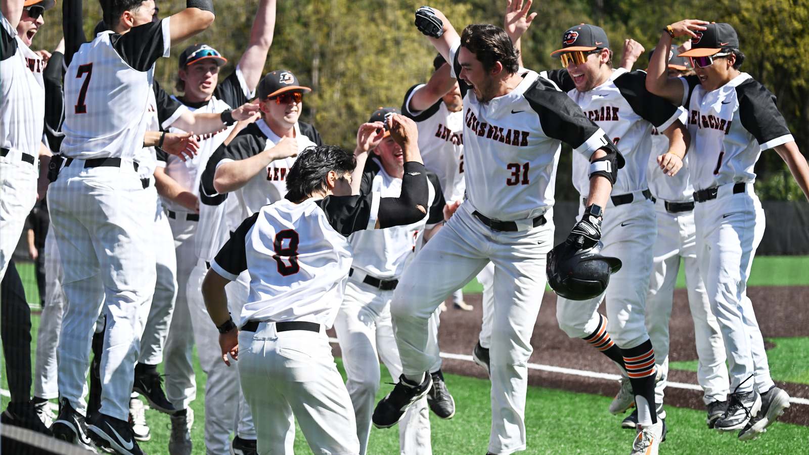 Baseball Celebrates a Dylan Lee home run against Pomona Pitzer.