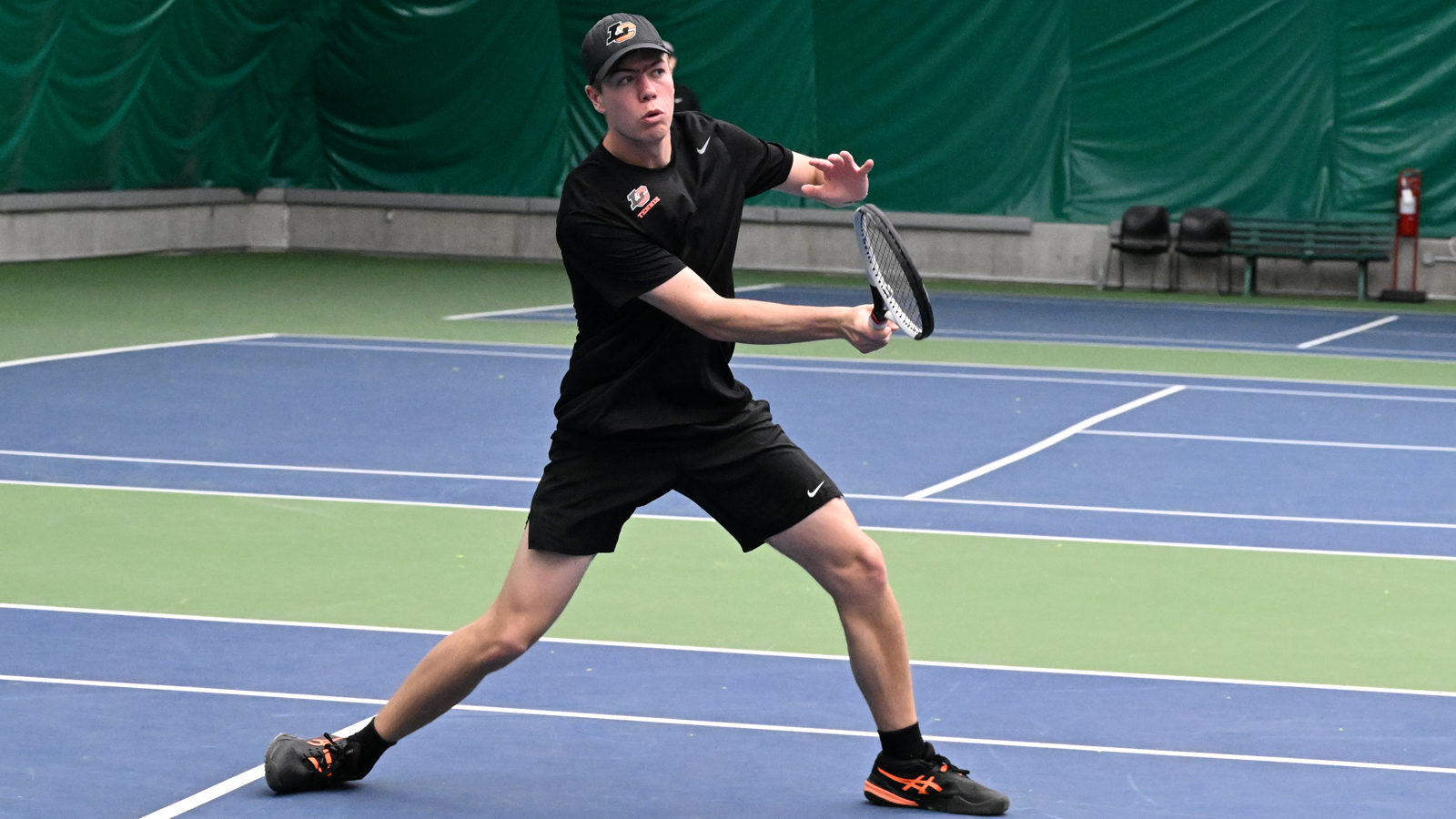 Kaden Sigurdsson hits a volley in a recent match.