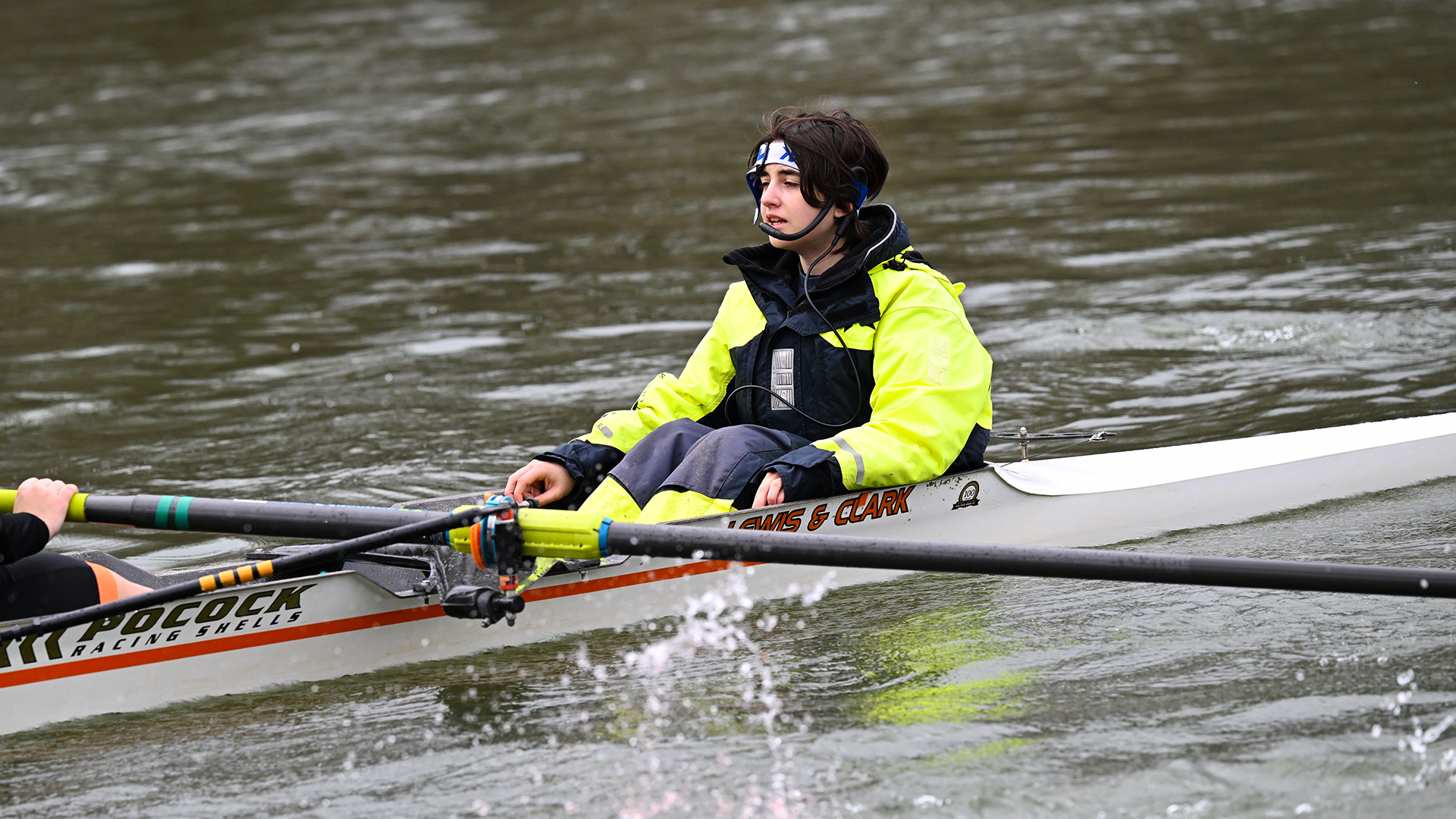 Coxswain Fay Seirafi wearing green directs the boat during a recent practice