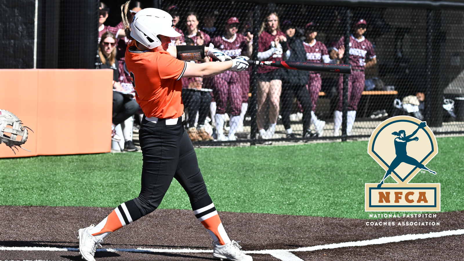 Emily Patton swings and hits a line drive 