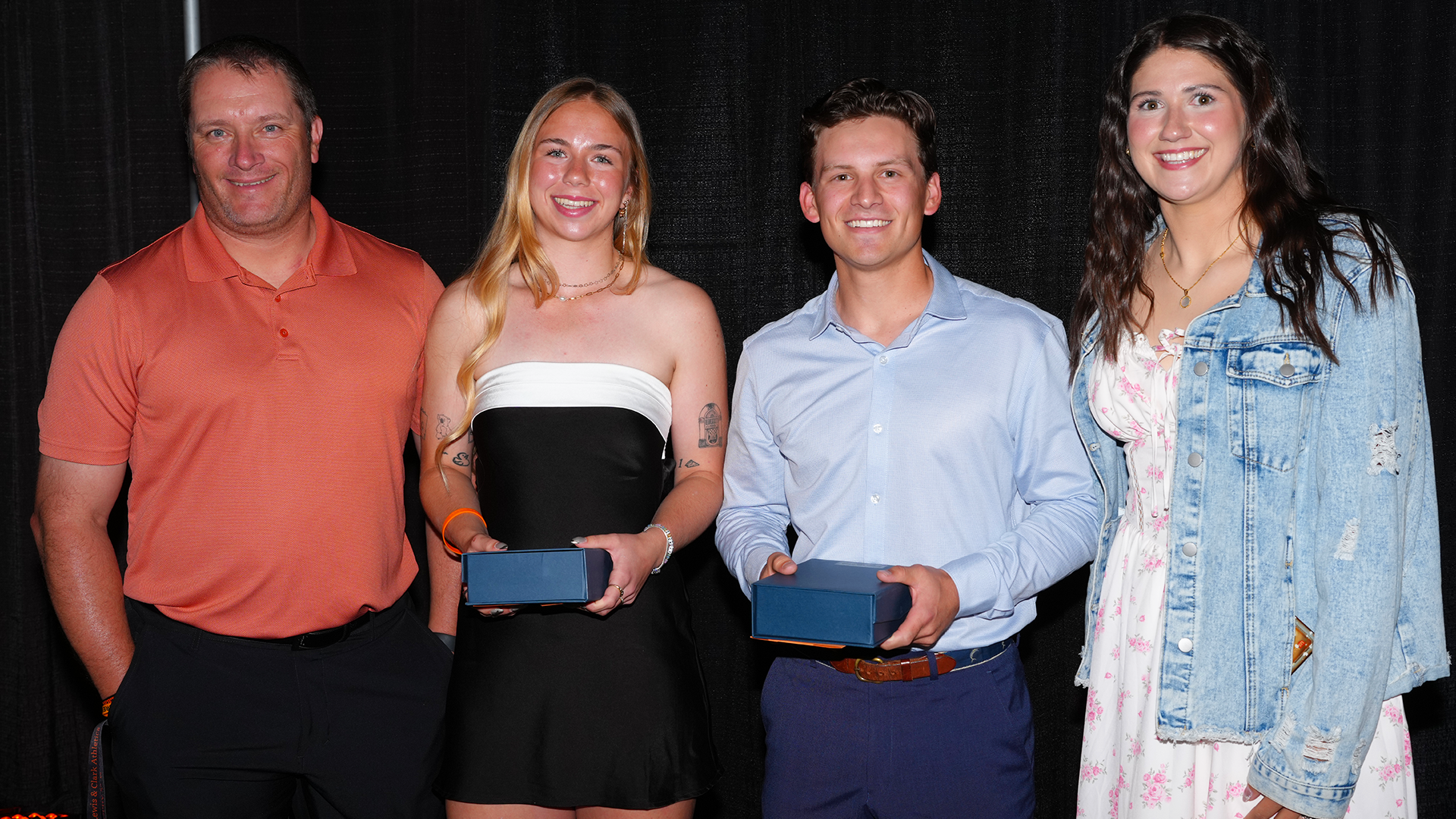 Coach Matt Kosderka, Kate Meinhard, Joaquin Sandoval and Coach Shianne Smith pose after the Champion award. 