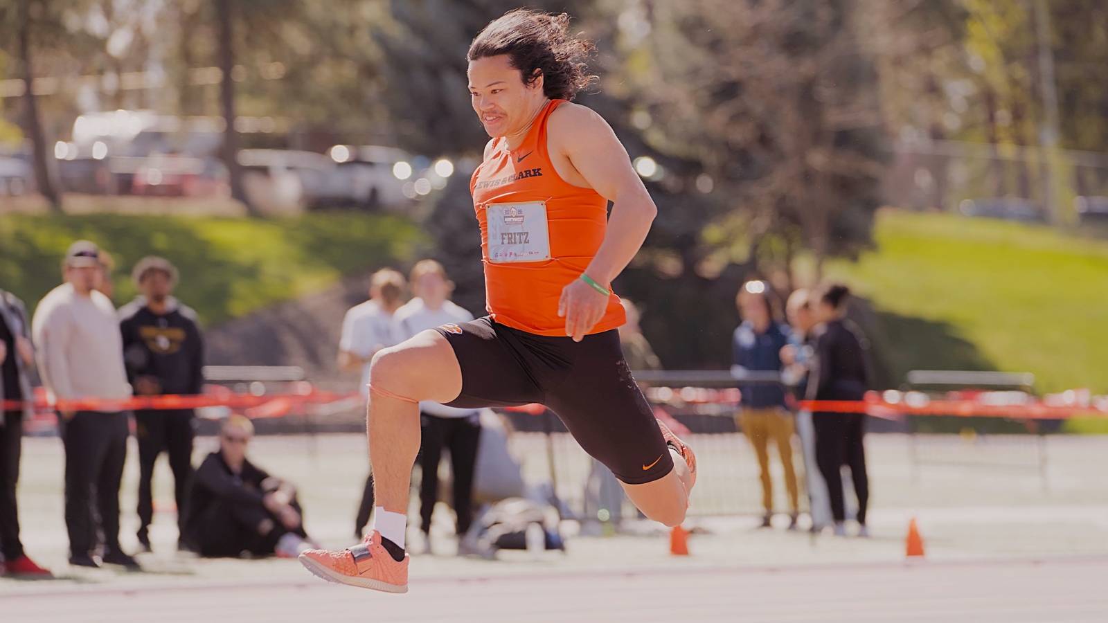 Jon Fritz is in mid-air after taking one of his jumps leading up to the final jump in the triple jump