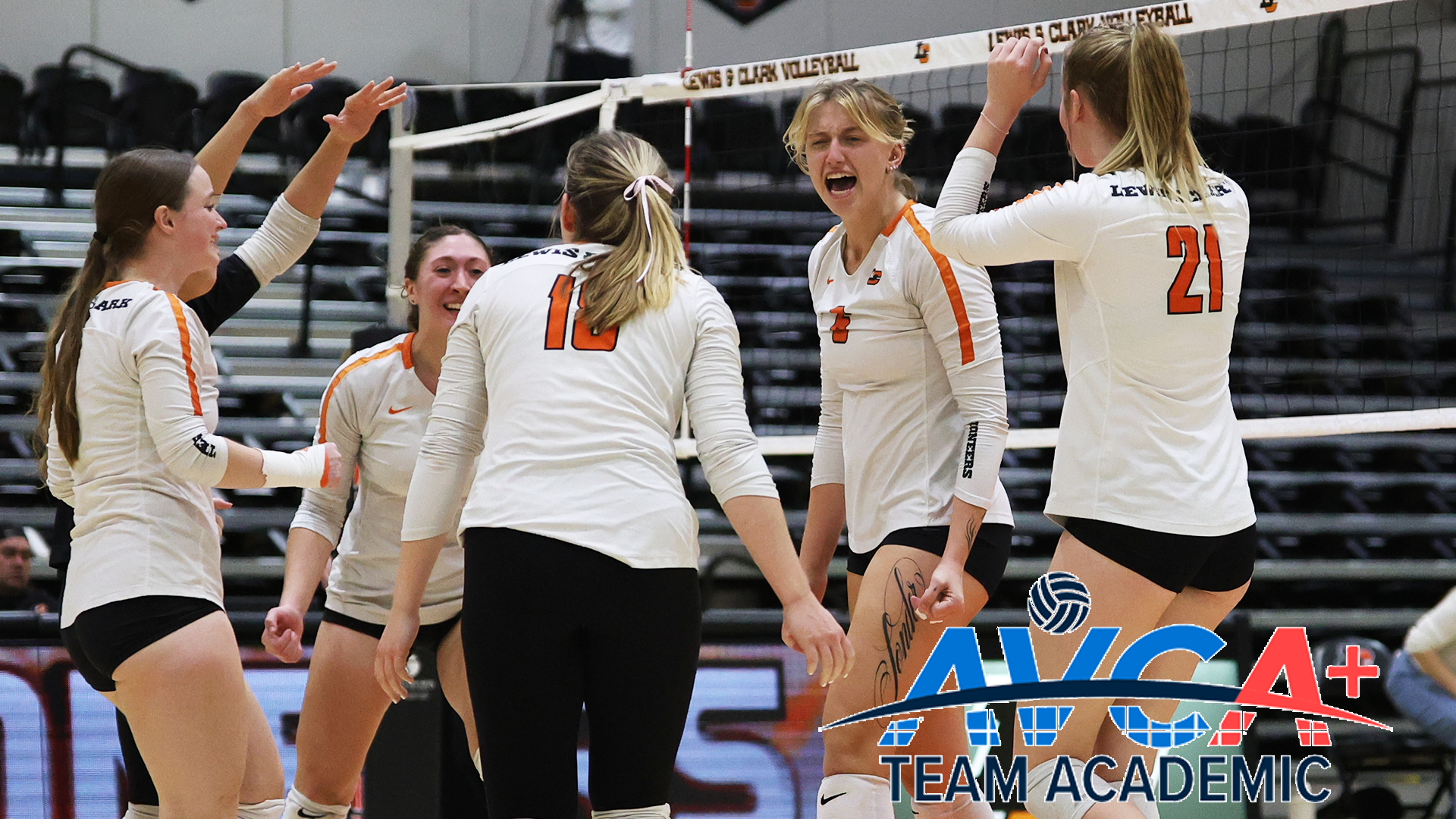 Members of the volleyball team celebrate a point. 