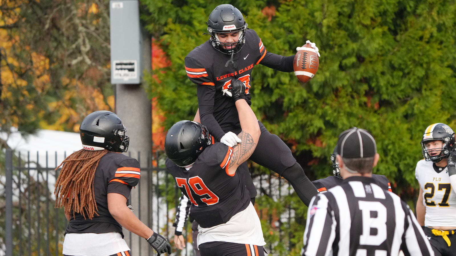 Dante Washington celebrates scoring a touchdown with Alex Litaea-Sniffen and Ramses Packer