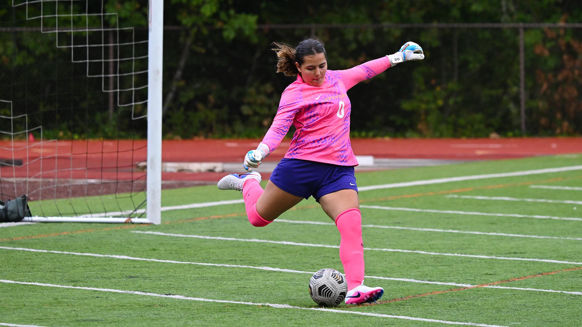 Lucia Barron Nunez kicks the ball out of the goal.