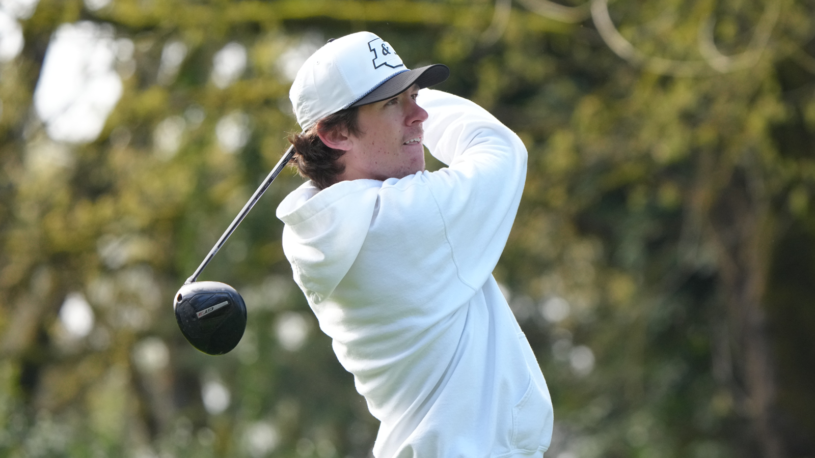 Kenji Pickeral hits a driver and watch the ball fly down the fairway