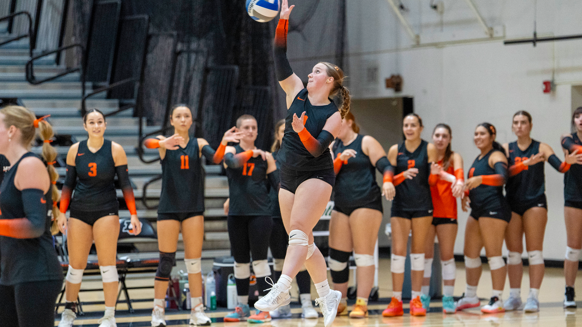 Kenzie Edwards serves during a match against Pacific. 