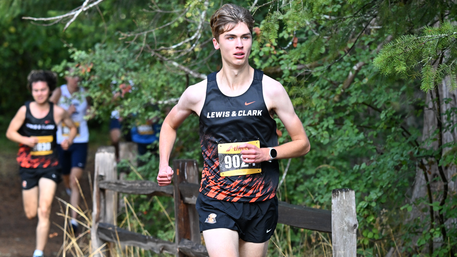 Dylan McGuirk runs along the river at the L&C XC Opener