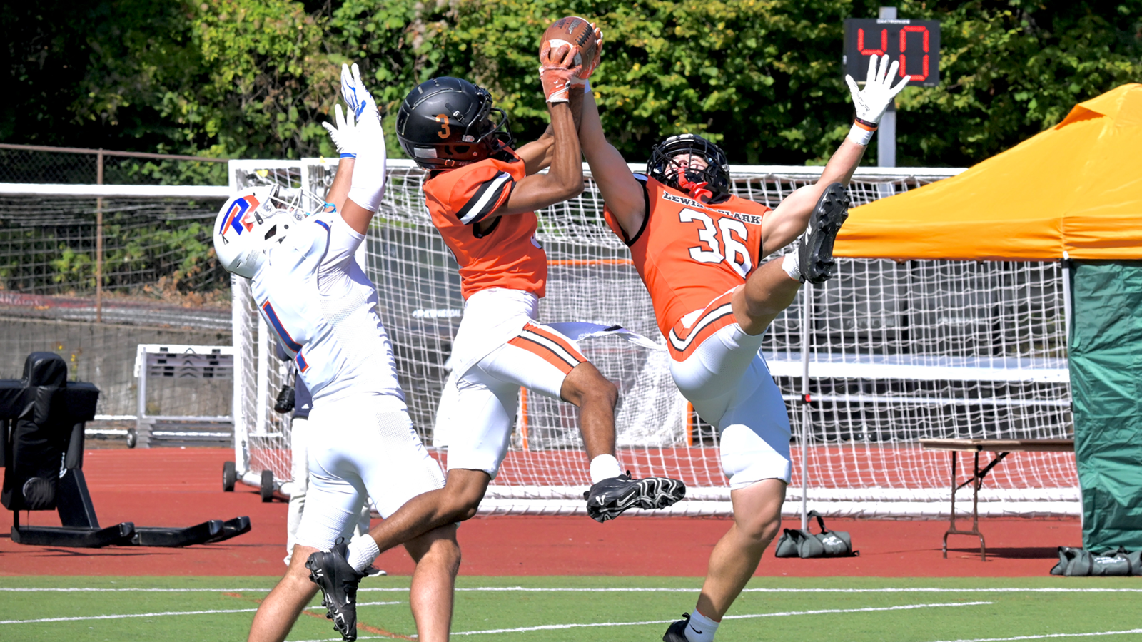 Kristopher Adams leaps up and grabs his second interception of the game