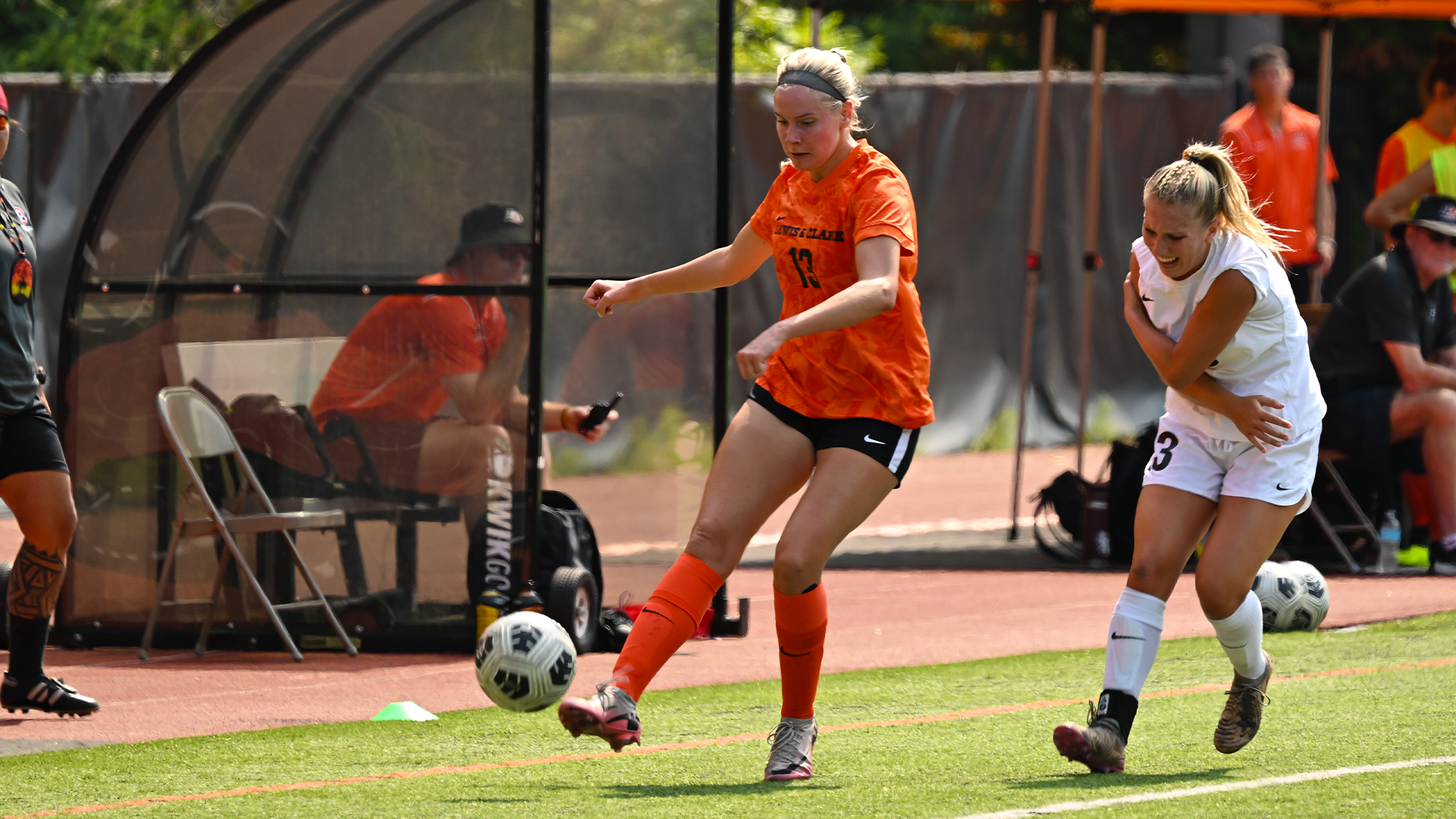 Maggie Faye kicks the ball past a defender.