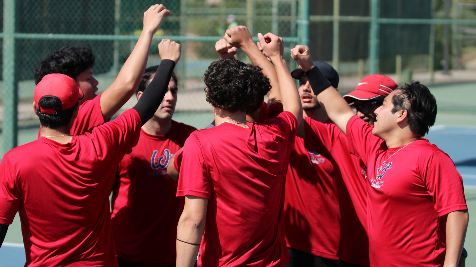 Men's tennis team huddle