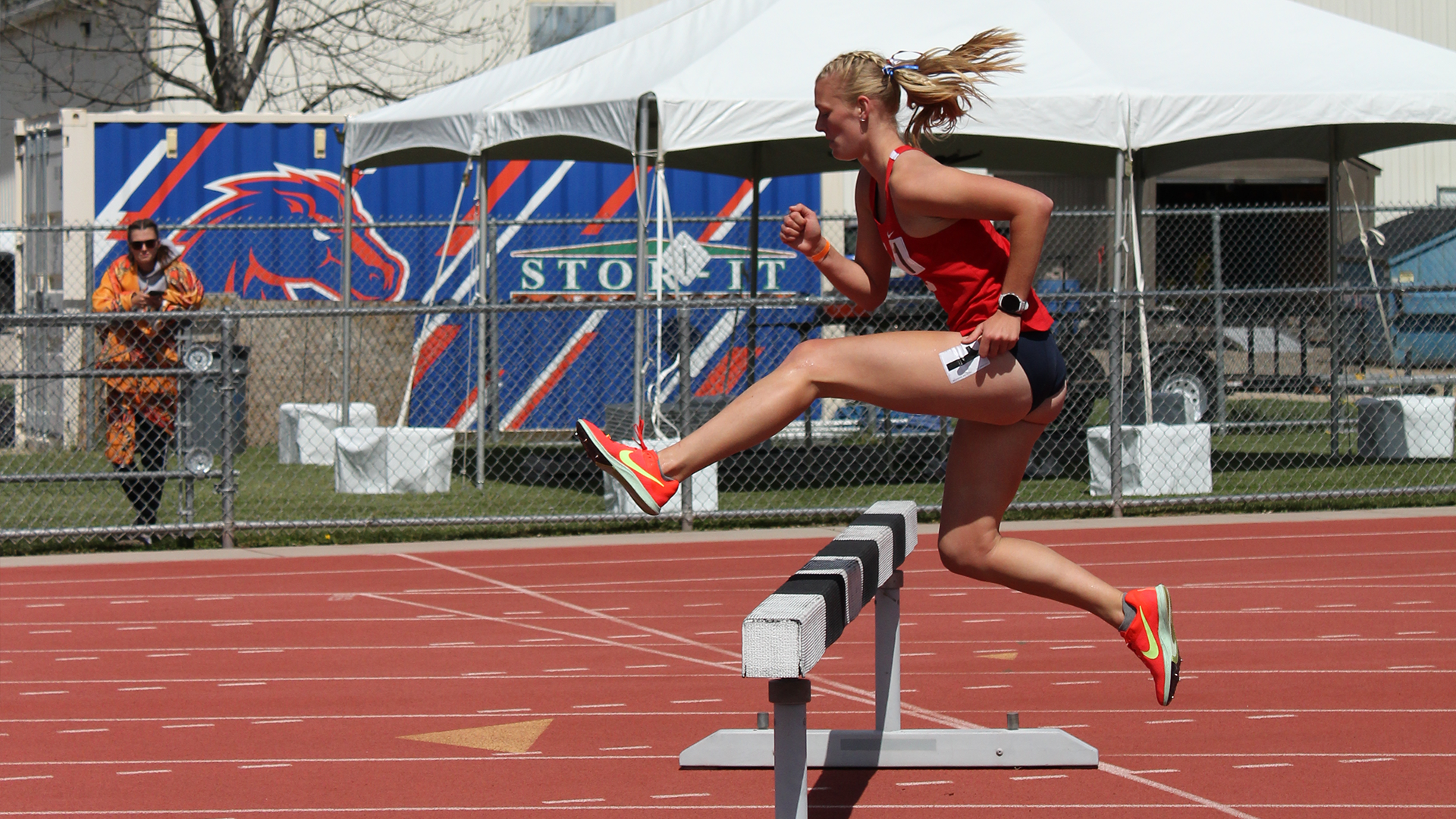 Nuala Rollins jumps over a steeple in the steeplechase