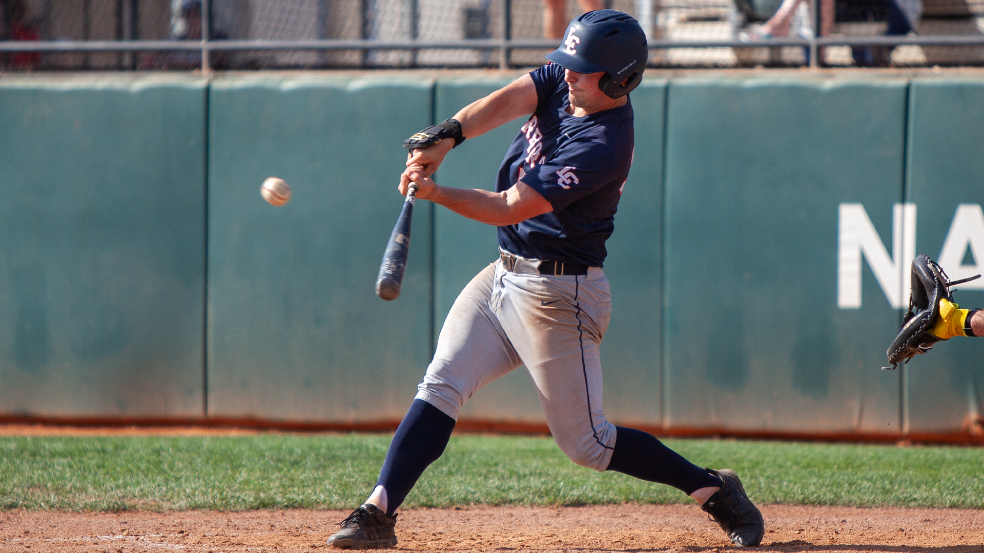 Jackson Reed swings and hits a baseball
