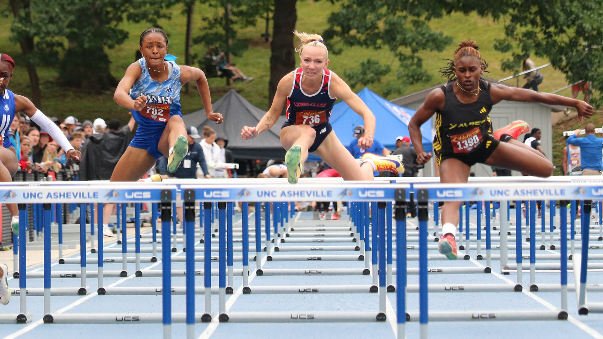 Madigan Kelly runs over a hurdle