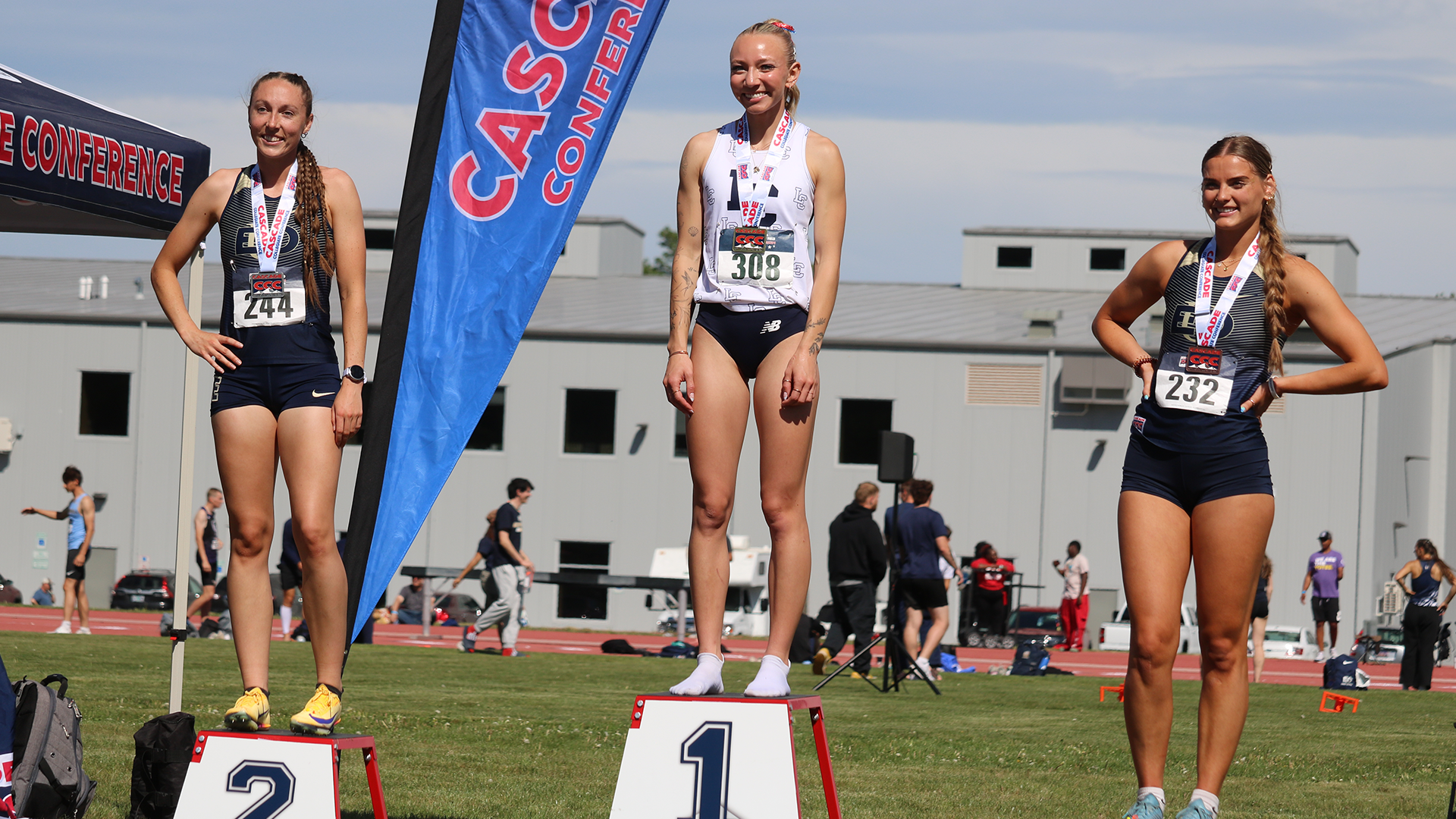 Madigan Kelly on top of the podium