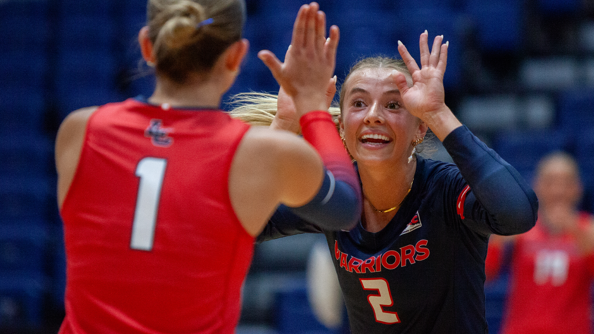 Ella Stosich high fives a teammate