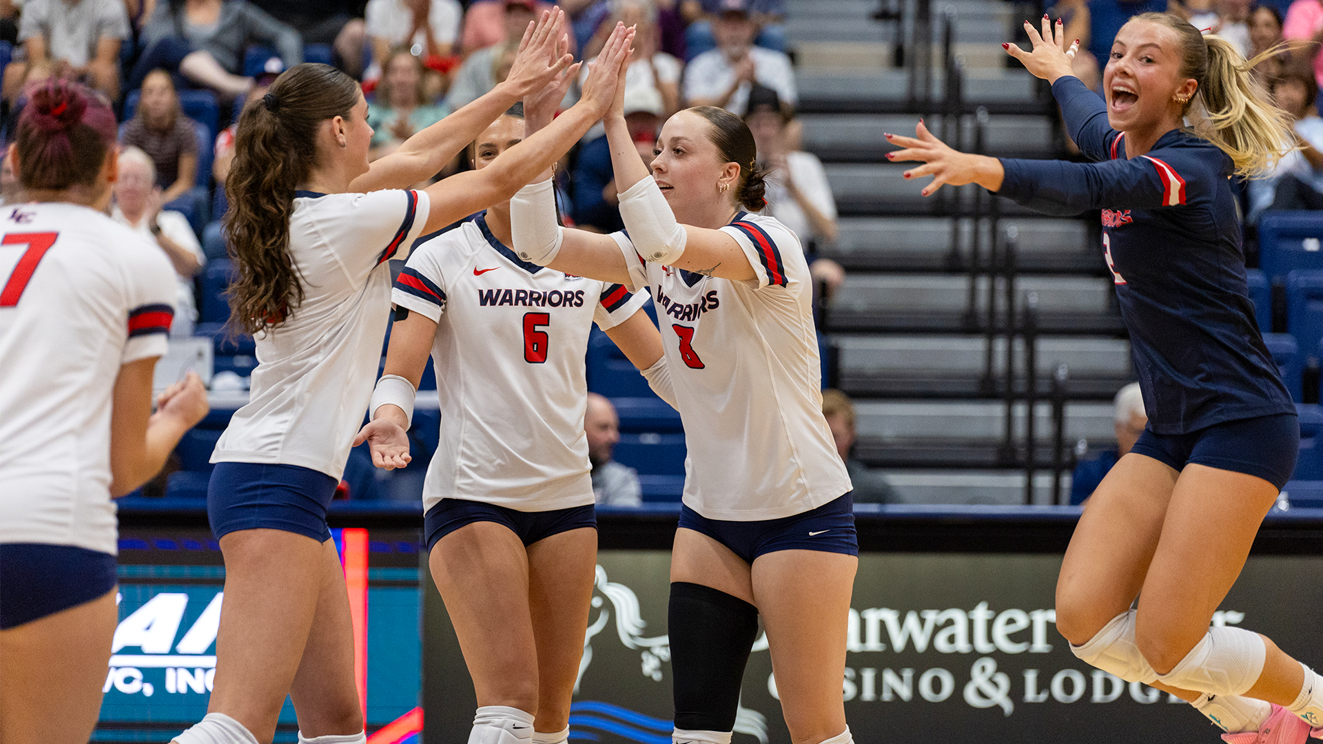 Teagan Scott and Hadyn Smith high five on the court