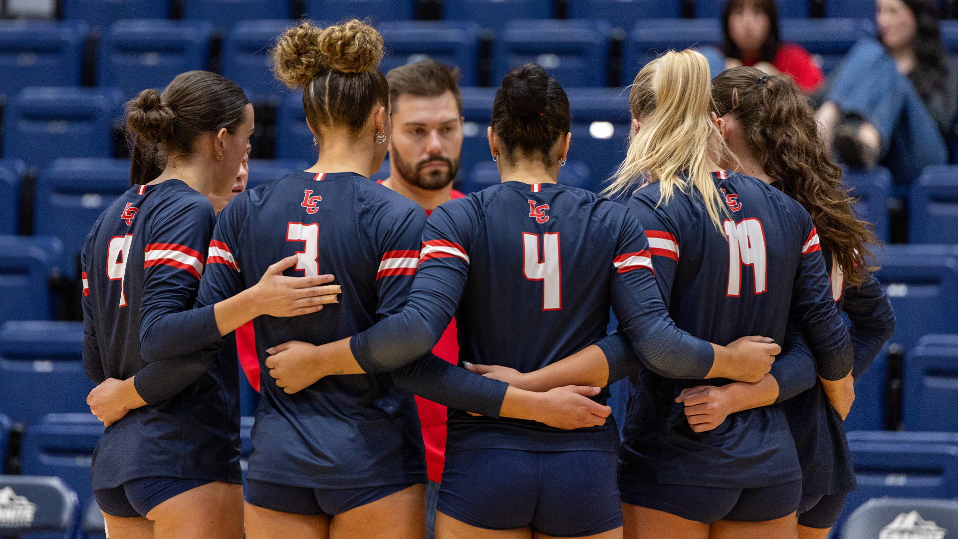 volleyball team huddled