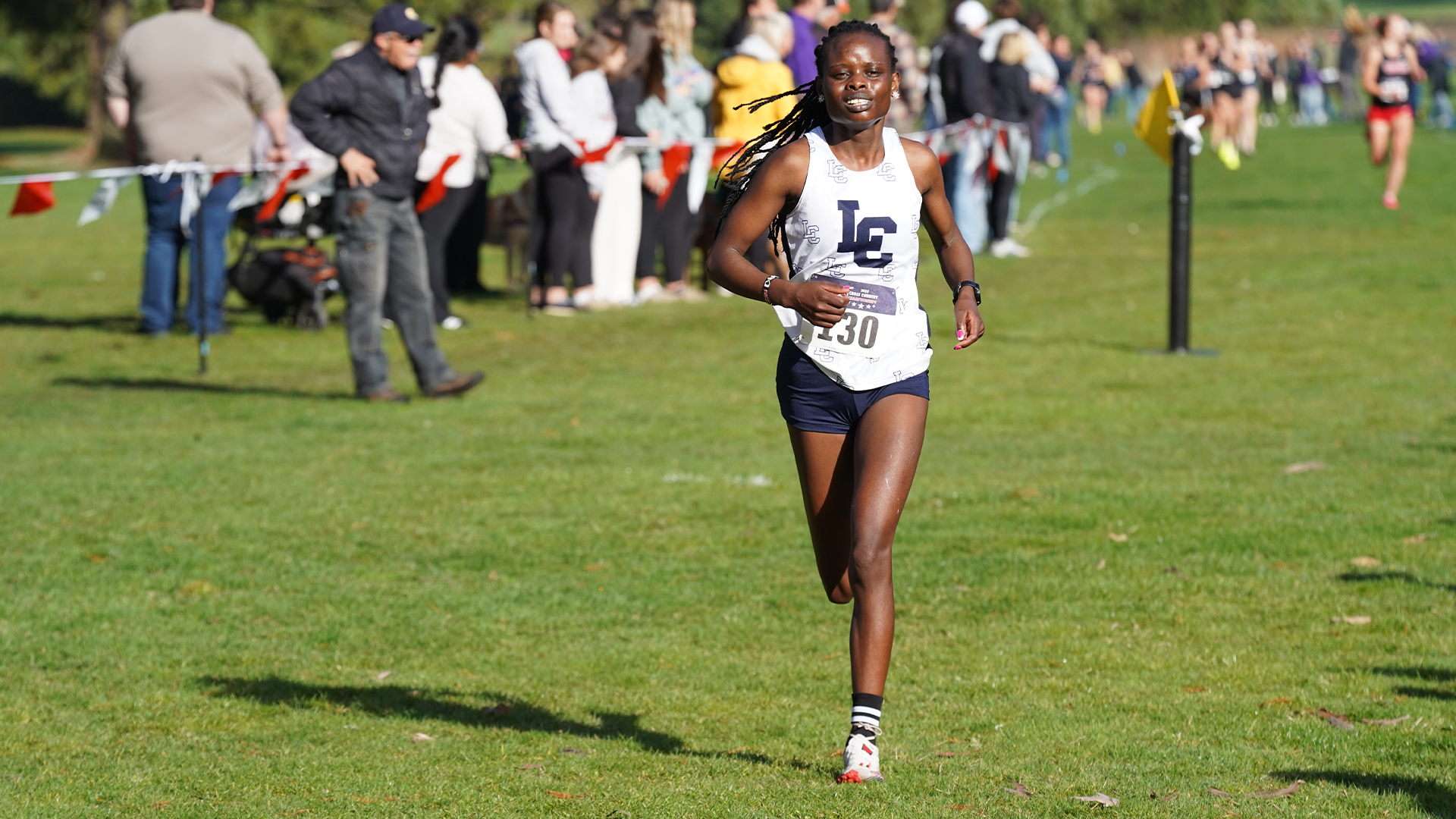 Damaris Kibiwot runs in a race