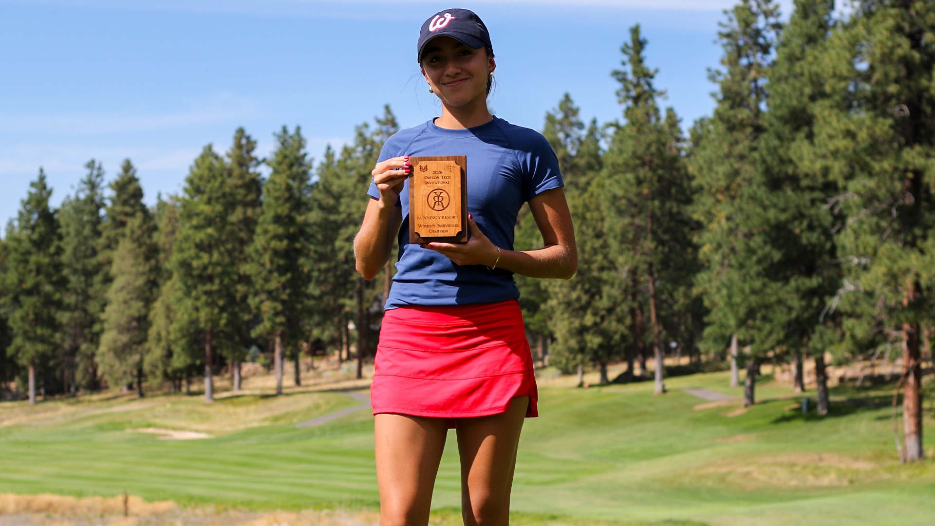 Isabella Barquet poses with award plaque