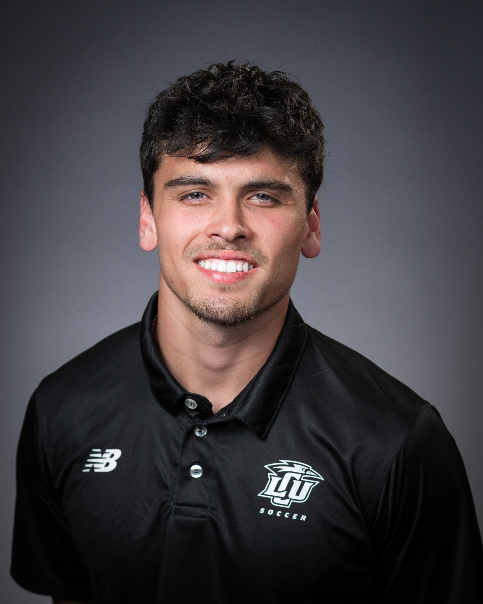 A headshot of LCU men's soccer coach Diego Berlingeri.