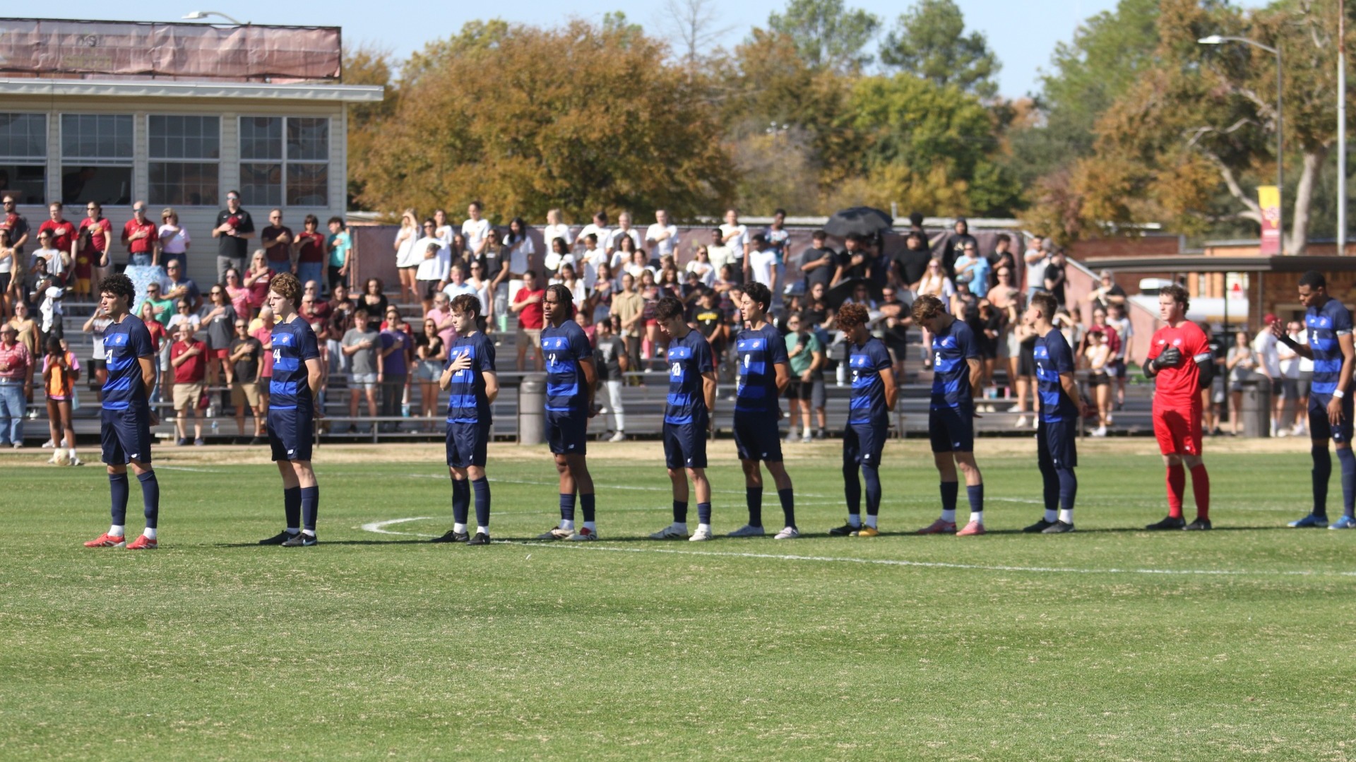 This is a photo of the Lubbock Christian men's soccer starters standing during the anthem during the Lone Star Conference Championship game on Nov. 15 at Stang Park.