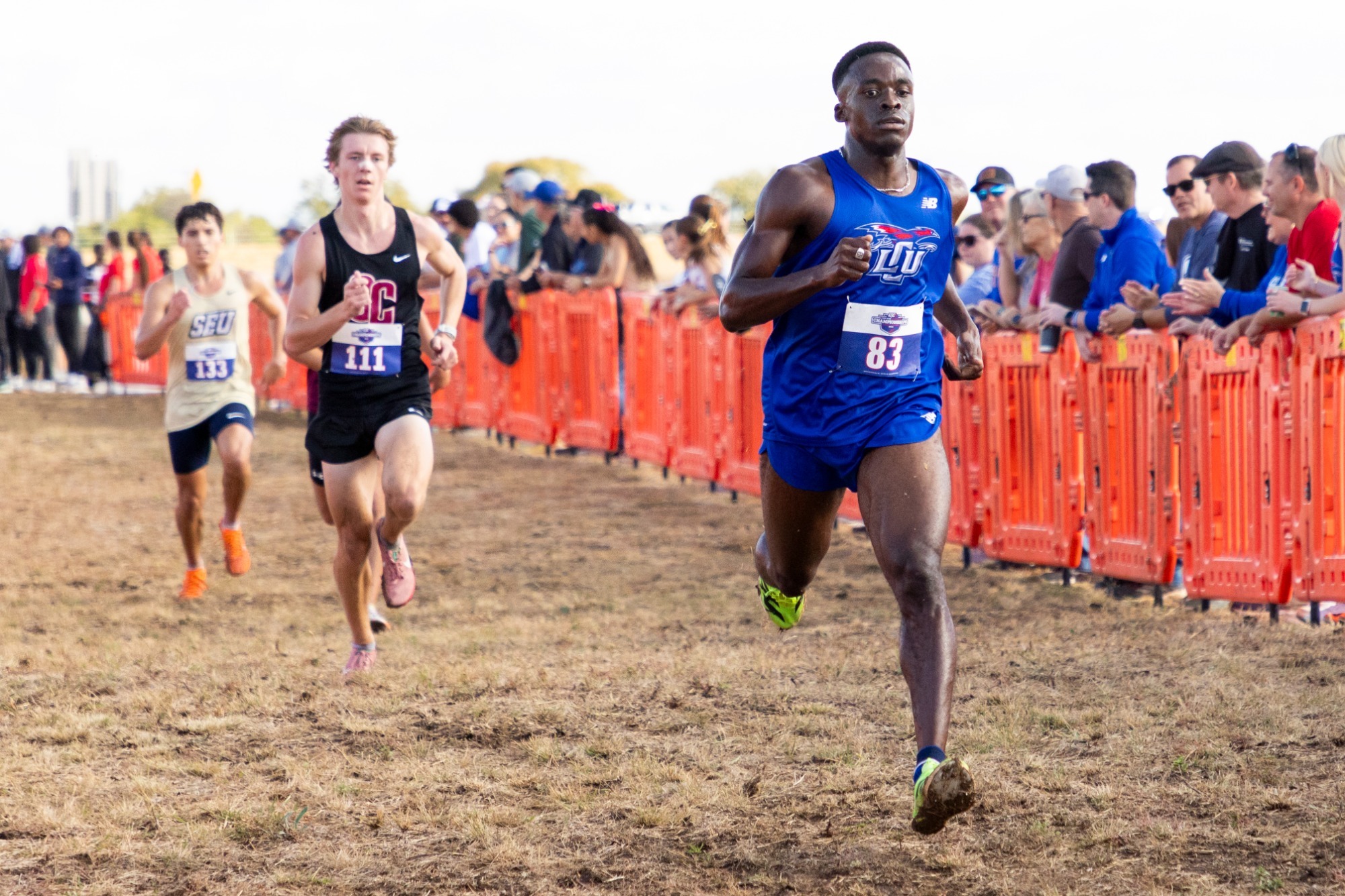 This is a photo of Lubbock Christian runner Matthew Gordon crossing the finish line at the LSC Championships.