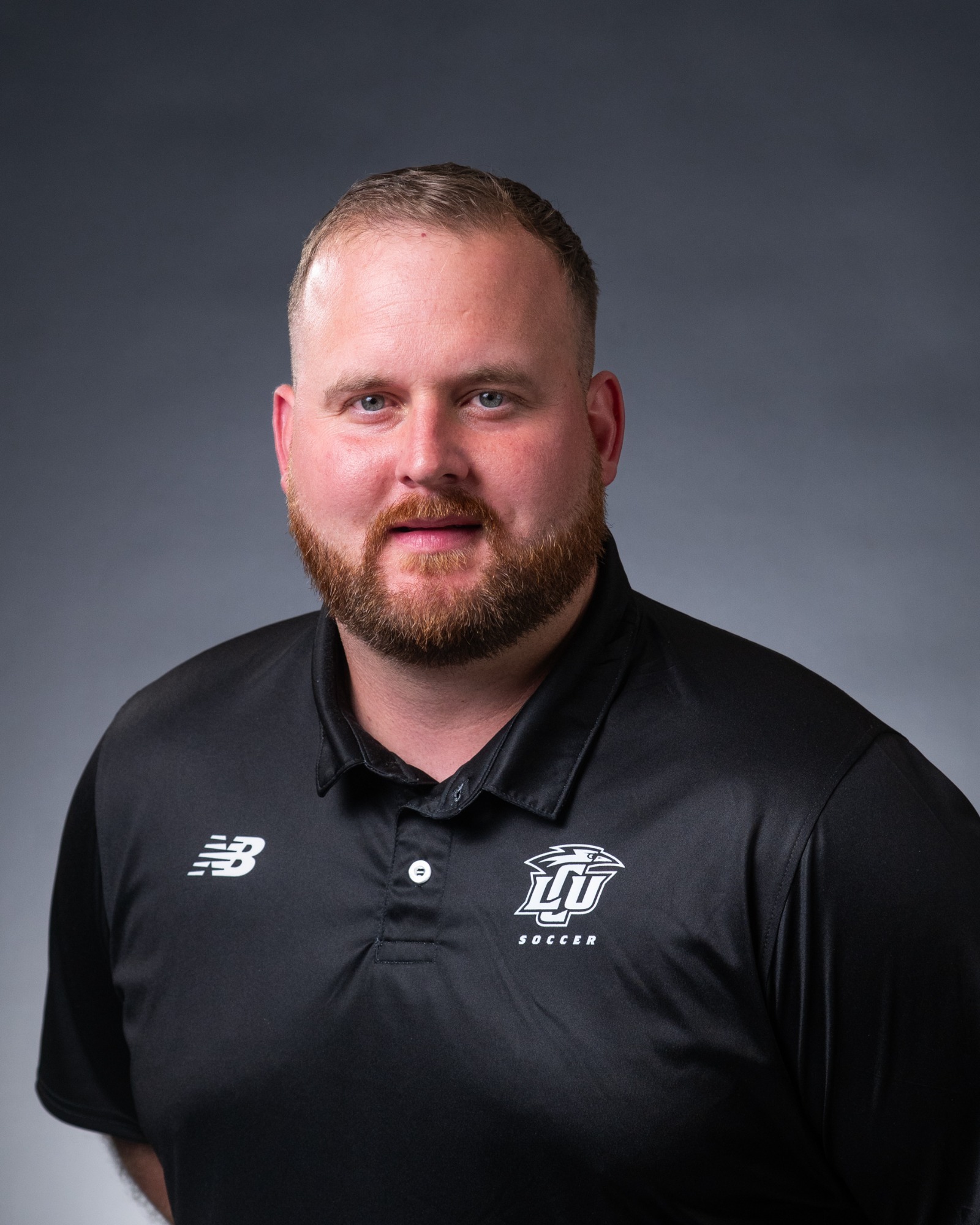 A headshot of men's soccer coach Collin Cone. 