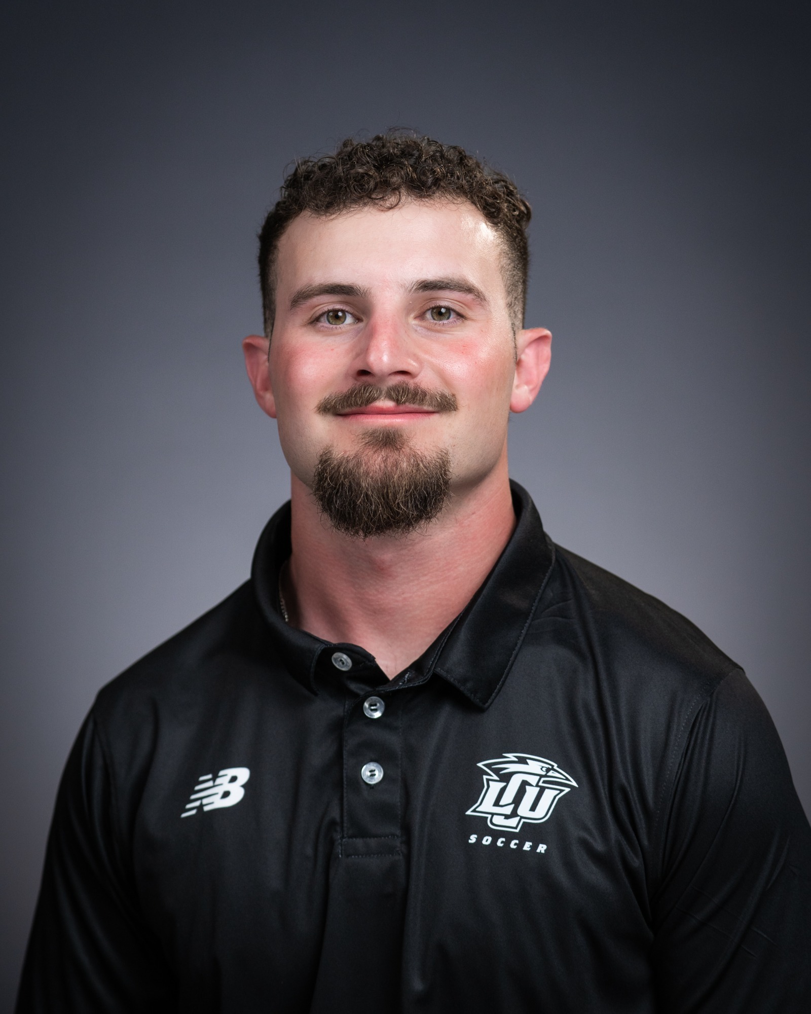 A headshot of strength and conditioning coach Noah Frederick.