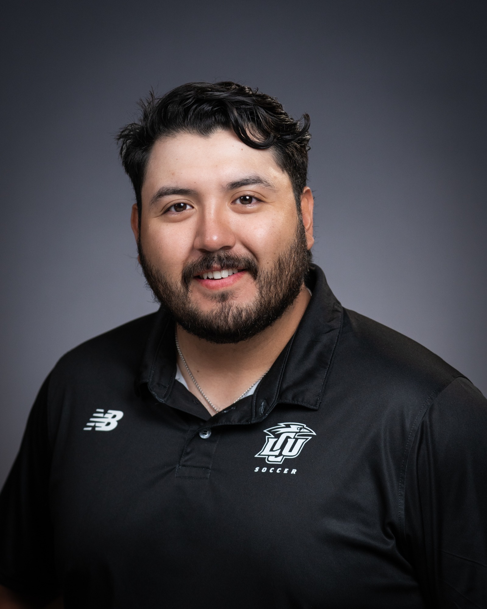 A headshot of athletic trainer Juan Mancilla. 