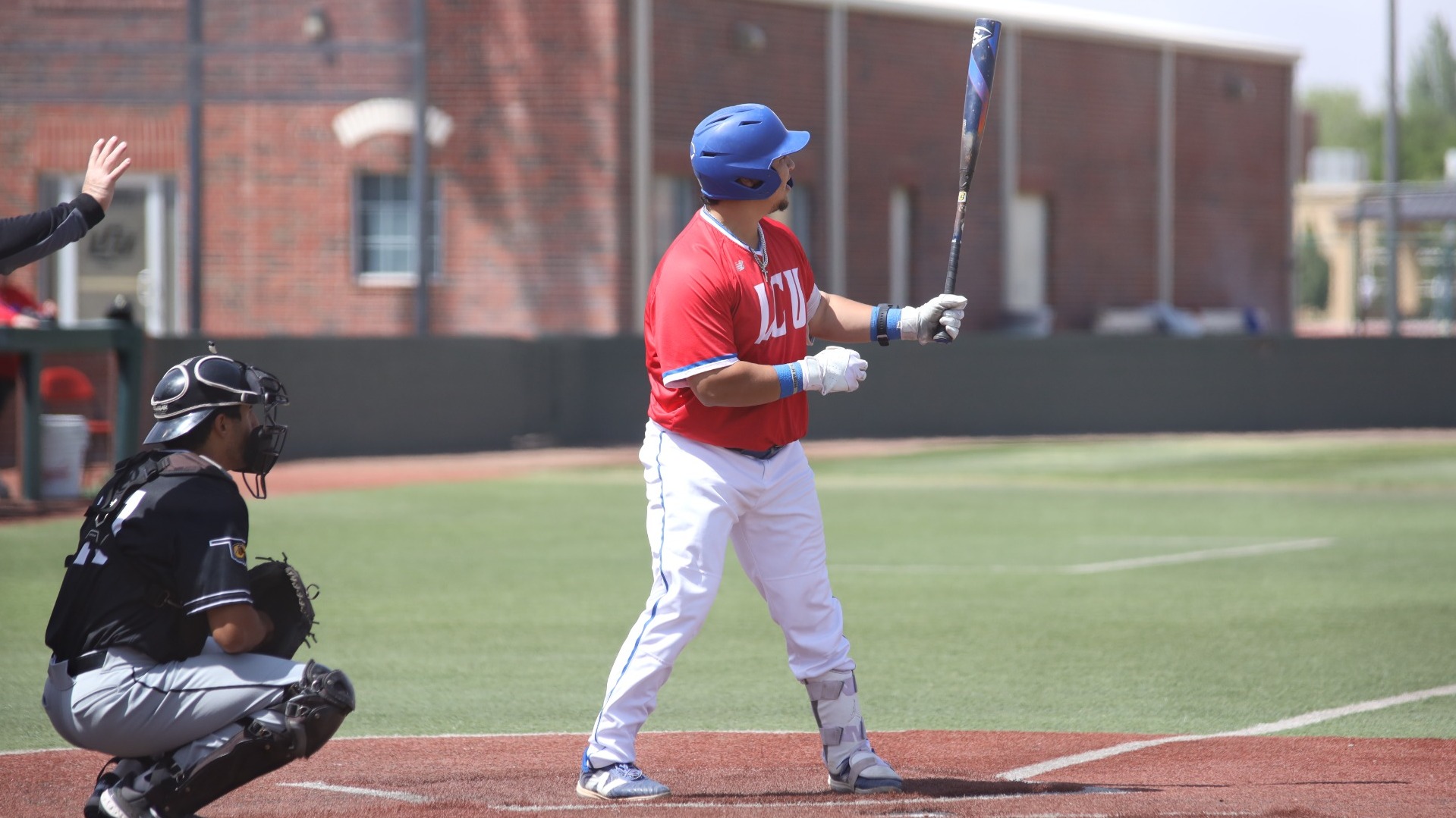This is a photo of LCU first basement Johnny Gomez III preparing to bat in a game at Hays Field. 