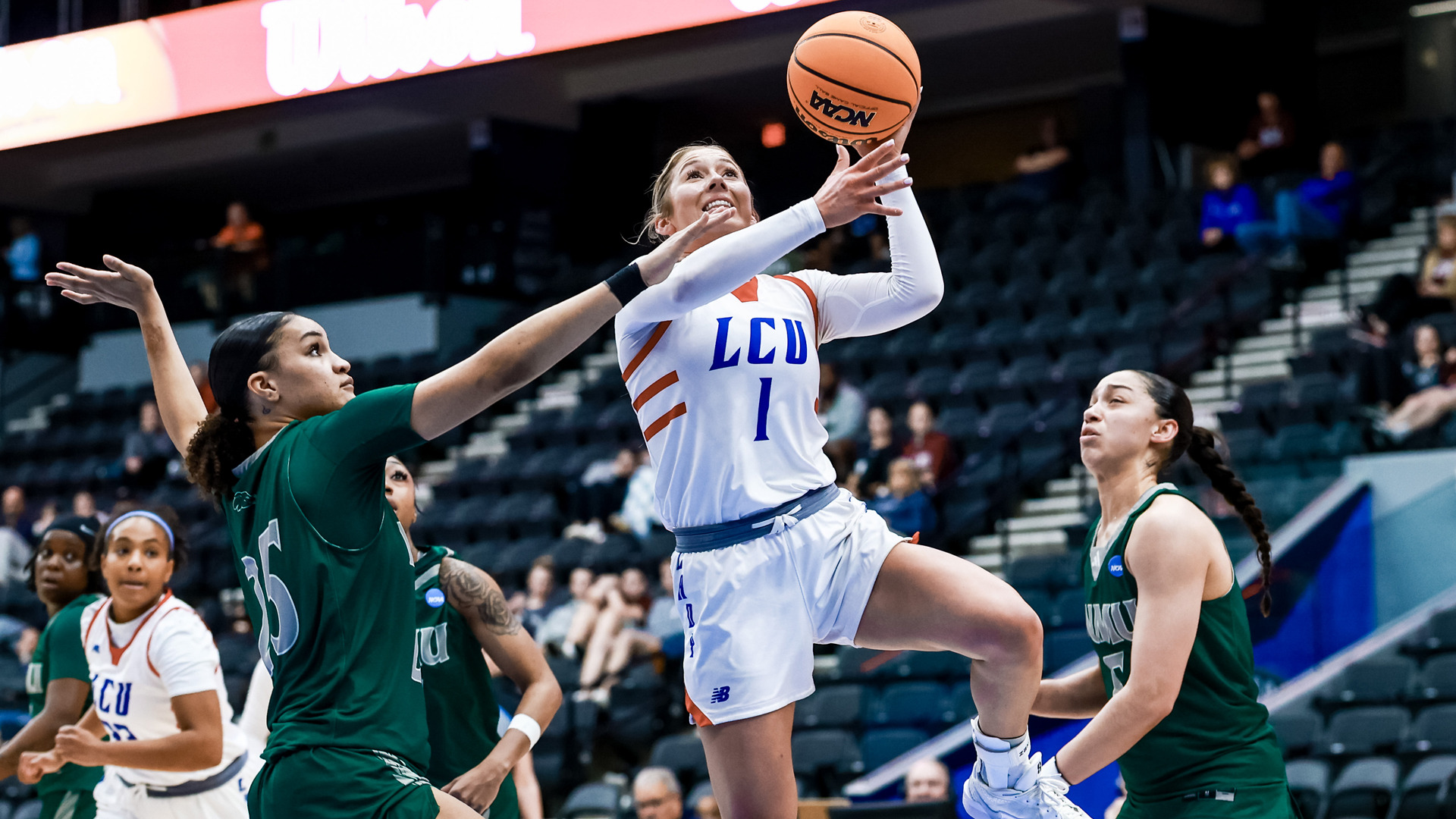 LCU Lady Chaps player number 1 drives to the basket for a layup past Eastern New Mexico defenders during the LSC Championship game at Comerica Center in Frisco, Texas