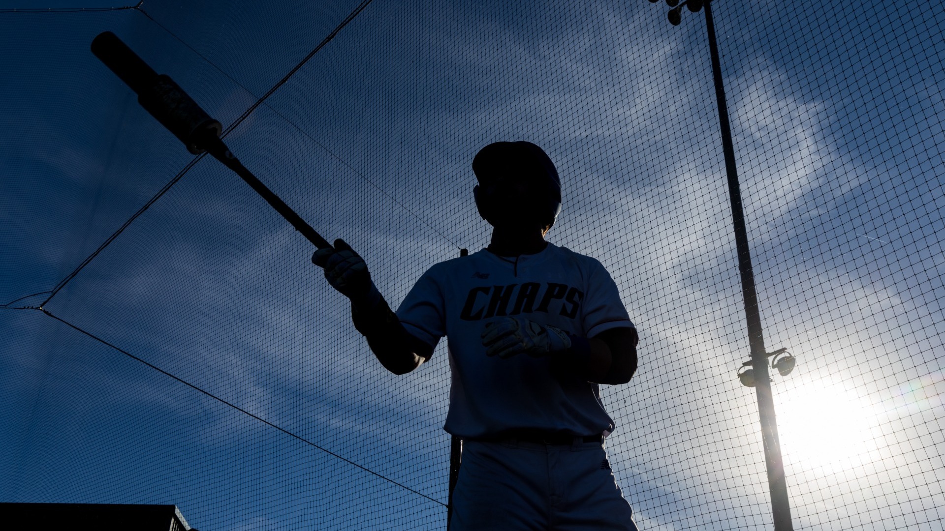 This is a photo of a Lubbock Christian batter warming up before hitting during a game at Hays Field. 