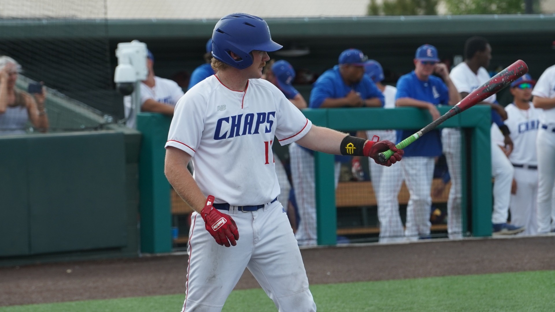 Lubbock Christian first baseman (white jersey, number 17), holds his bat out in front of him as he prepares to hit during a baseball game at Hays Field. 